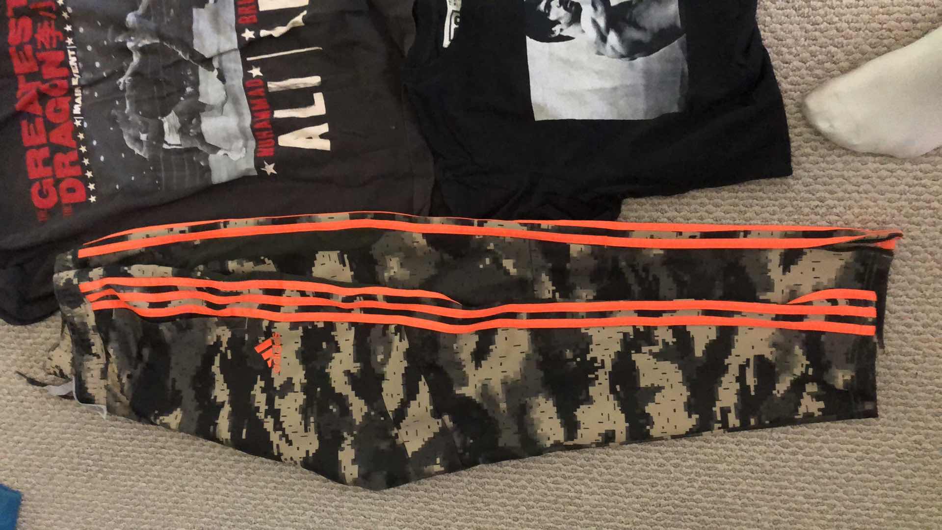 Photo 1 of ASSORTMENT OF GRAPHIC TEE SHIRTS AND ADIDAS PANTS