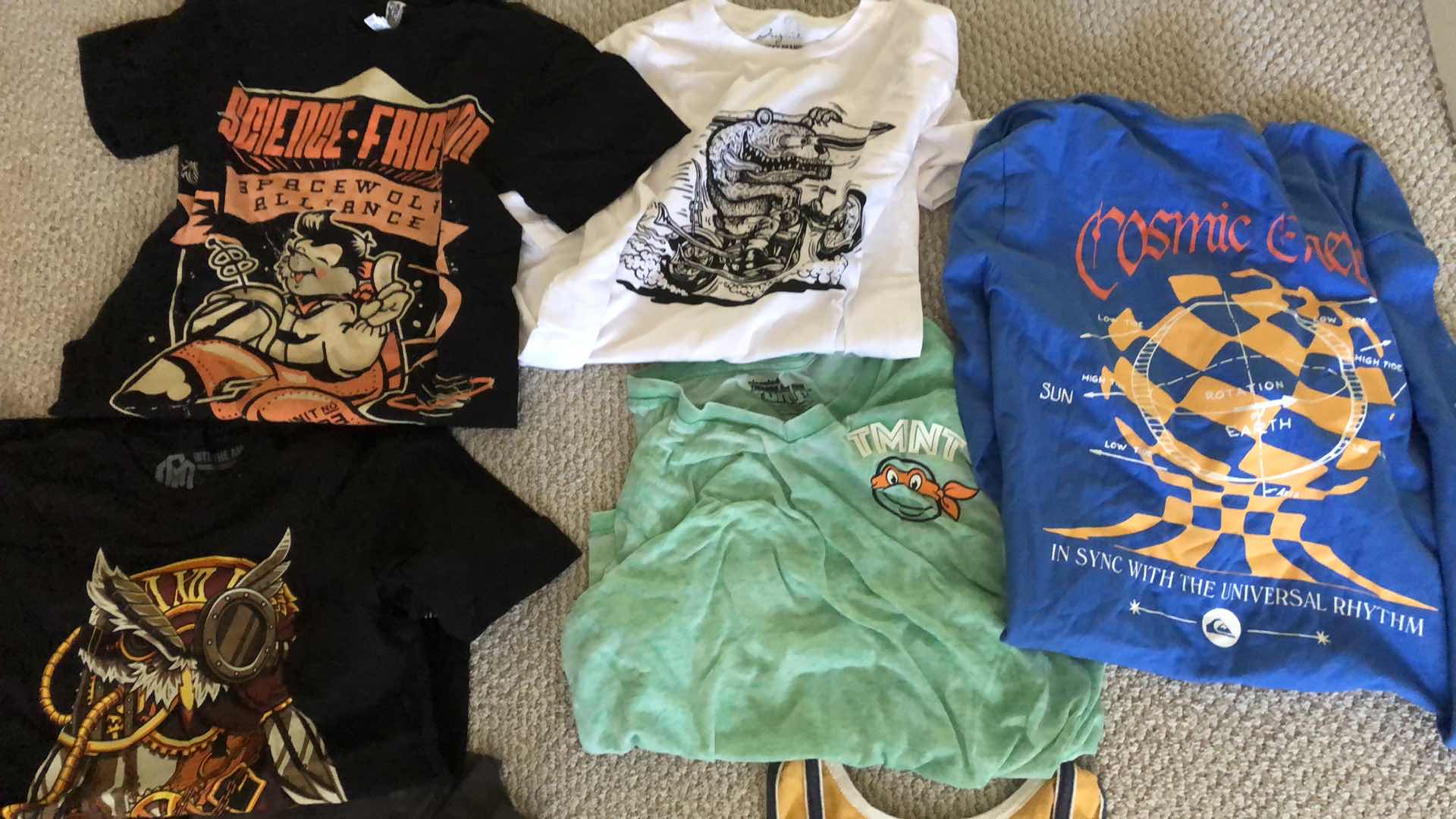 Photo 1 of ASSORTMENT OF GRAPHIC TEE SHIRTS AND ADIDAS PANTS