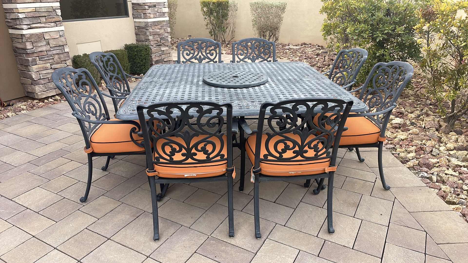 Photo 2 of LUXURY PATIO FURNITURE SET - TABLE 64” X 64” WITH 8 CHAIRS ORANGE CUSHIONS WITH BLACK WELTING