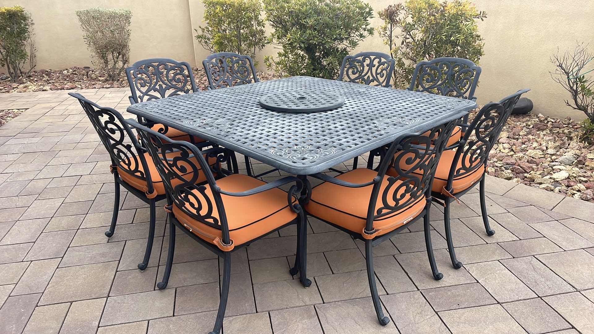 Photo 1 of LUXURY PATIO FURNITURE SET - TABLE 64” X 64” WITH 8 CHAIRS ORANGE CUSHIONS WITH BLACK WELTING