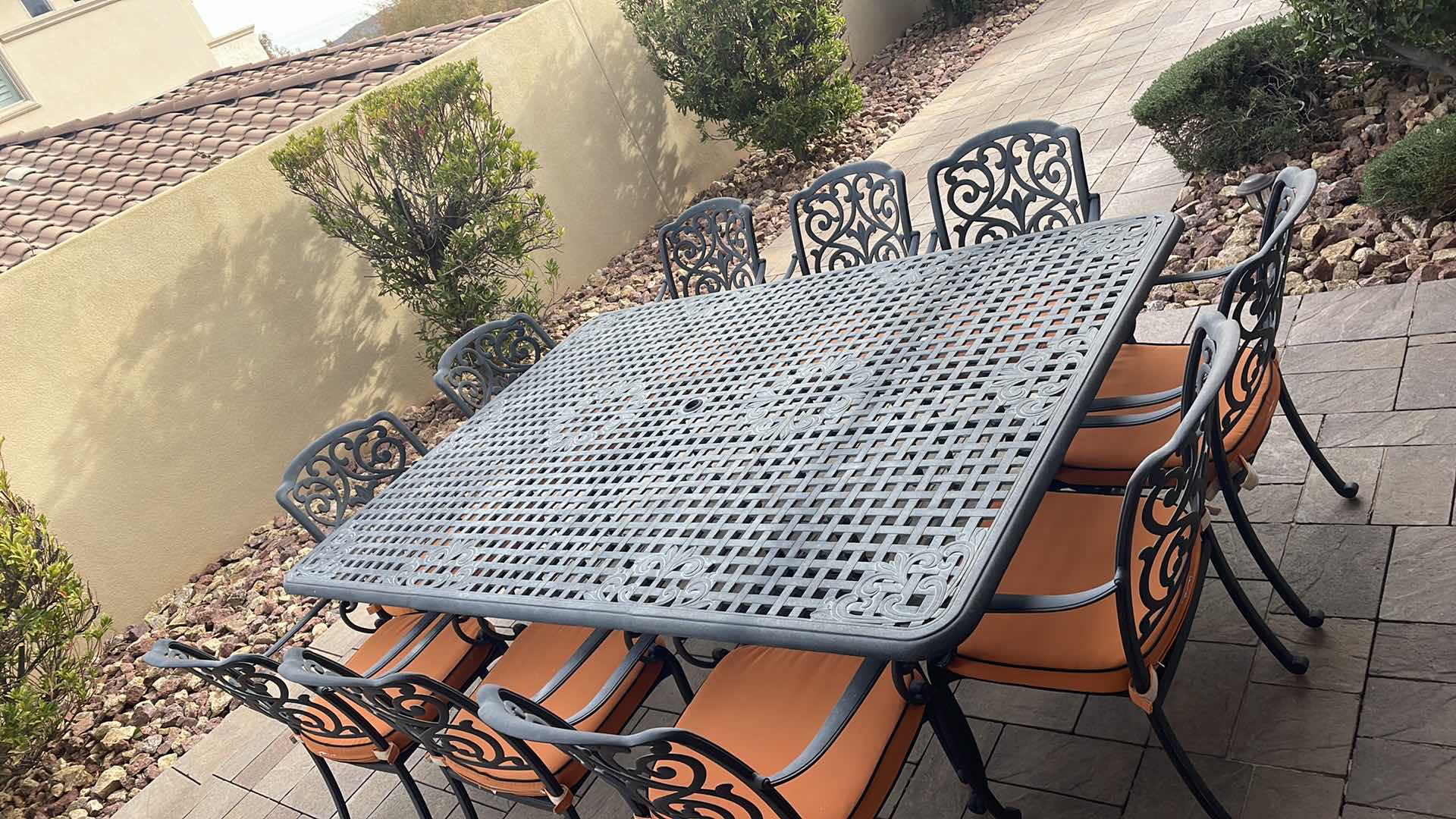 Photo 2 of LUXURY PATIO FURNITURE SET - TABLE 64” X 90” WITH 10 CHAIRS ORANGE CUSHIONS WITH BLACK WELTING