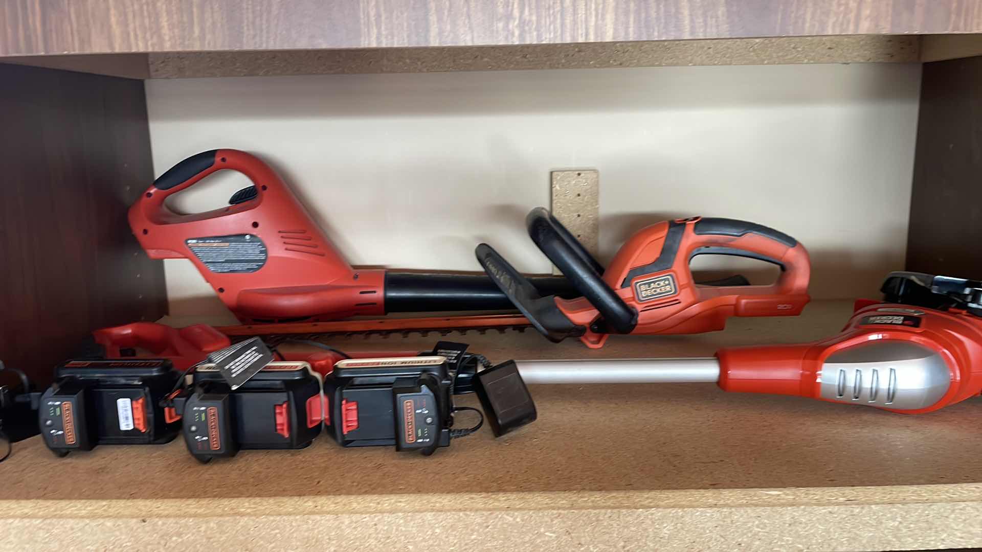 Photo 1 of BLACK & DECKER, 20 V BLOWER HEDGER AND WEEDEATER THREE BATTERIES, THREE CHARGERS