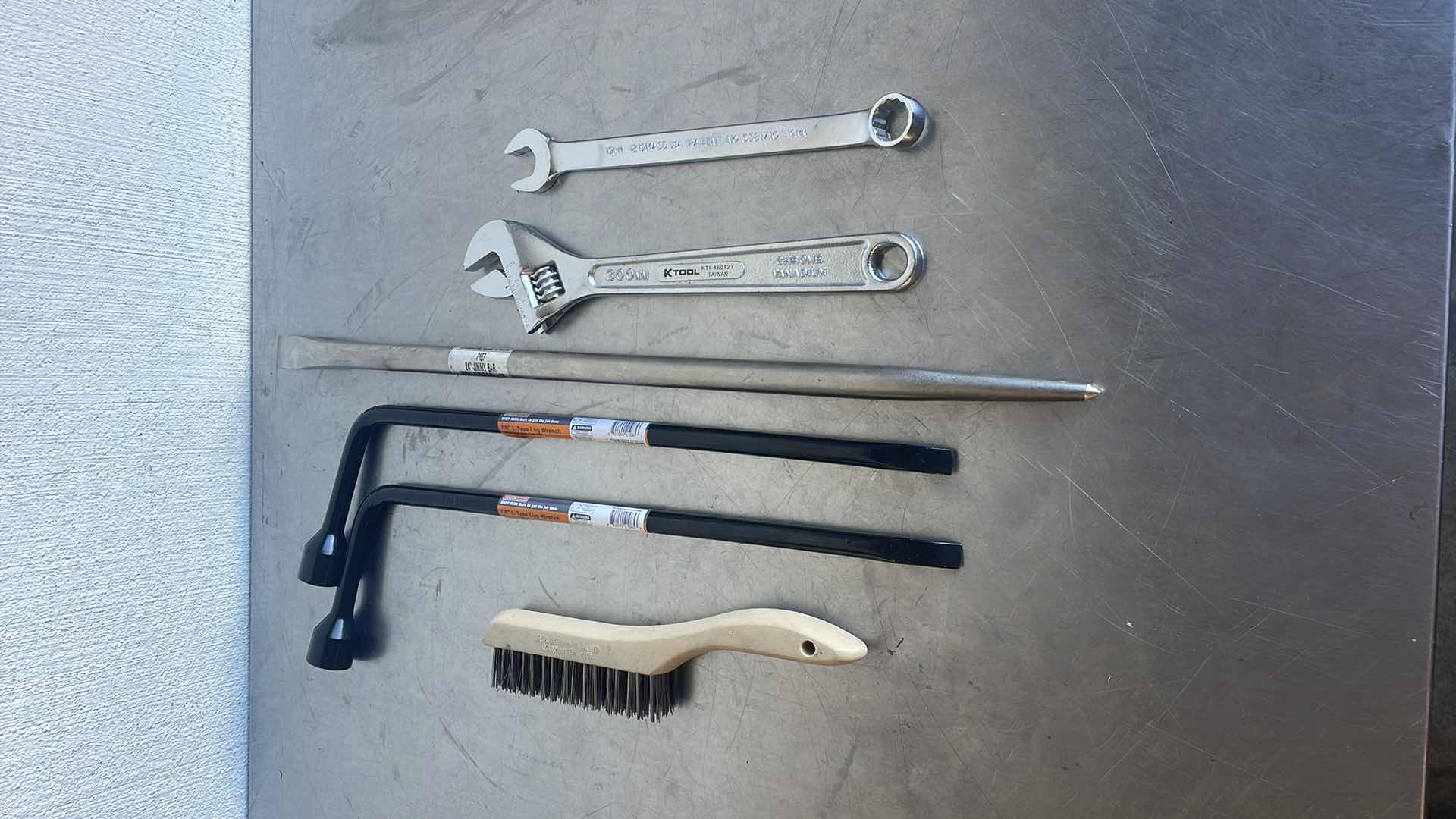 Photo 1 of SPX OTC 24” JIMMY BAR, 12” ADJUSTABLE WRENCH, 19MM OPEN END COMBO WRENCH, 2 7/8” L-TYPE LUG WRENCHES, WIRE BRUSH