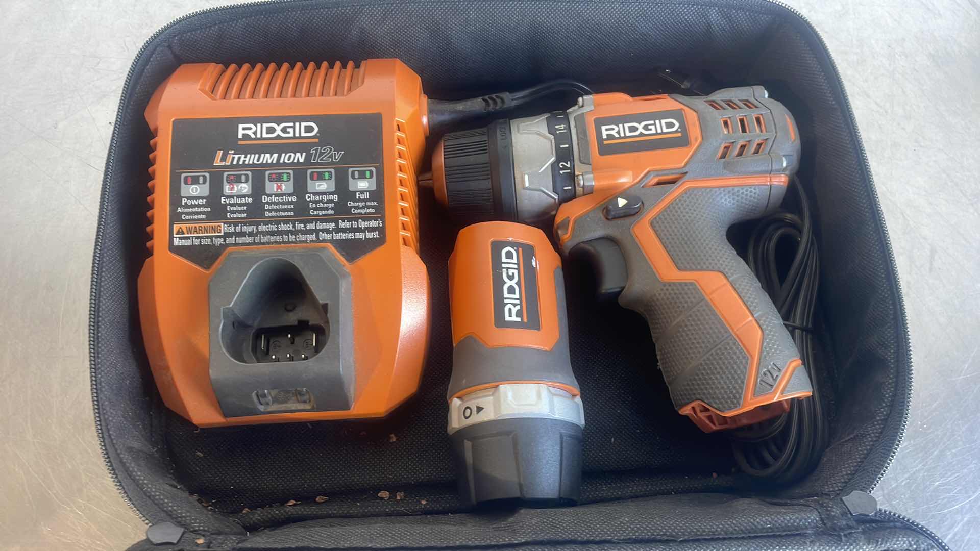 Photo 2 of RIDGID 12V WORKLIGHT R82920 & 3/8” 12V DRILL R82009 WITH CHARGER IN SOFT CASE NO BATTERY UNTESTED