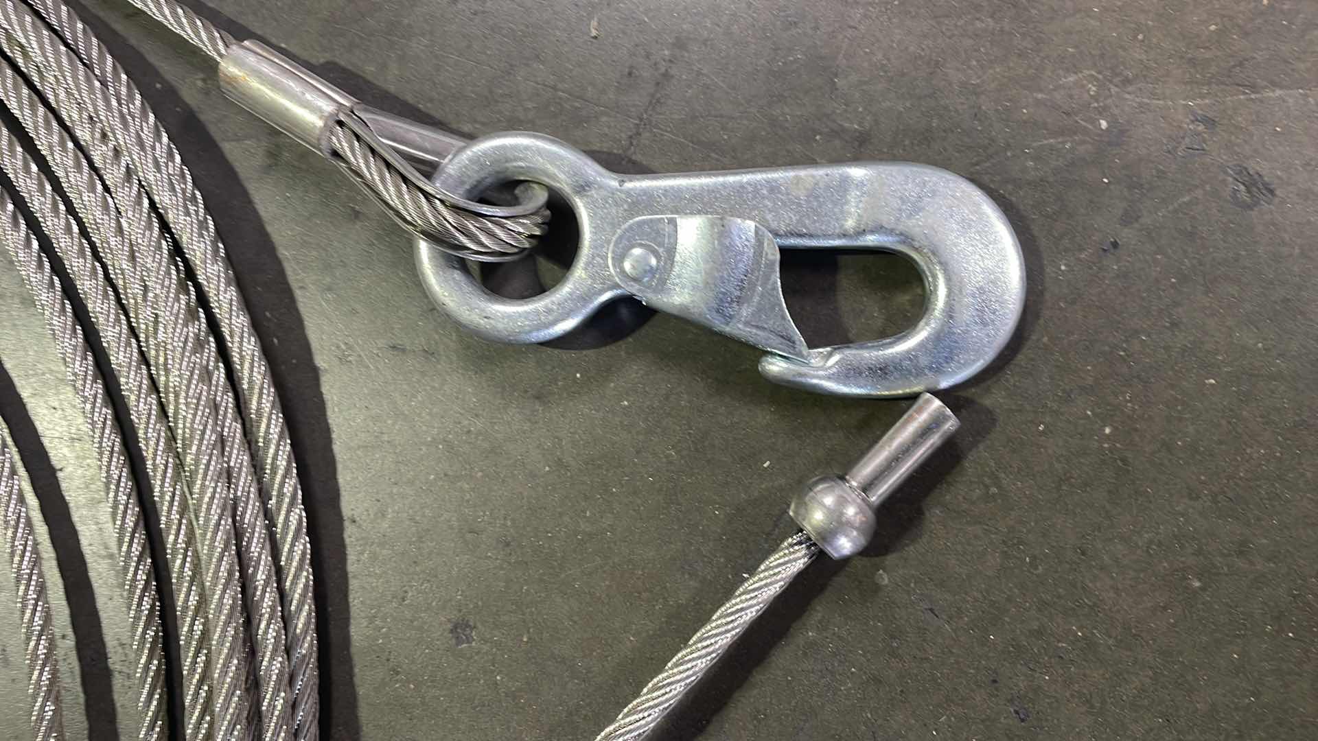 Photo 2 of 5/16” WIRE ROPE WITH HOOK RATED TO 5000LBS UNKNOWN LENGTH