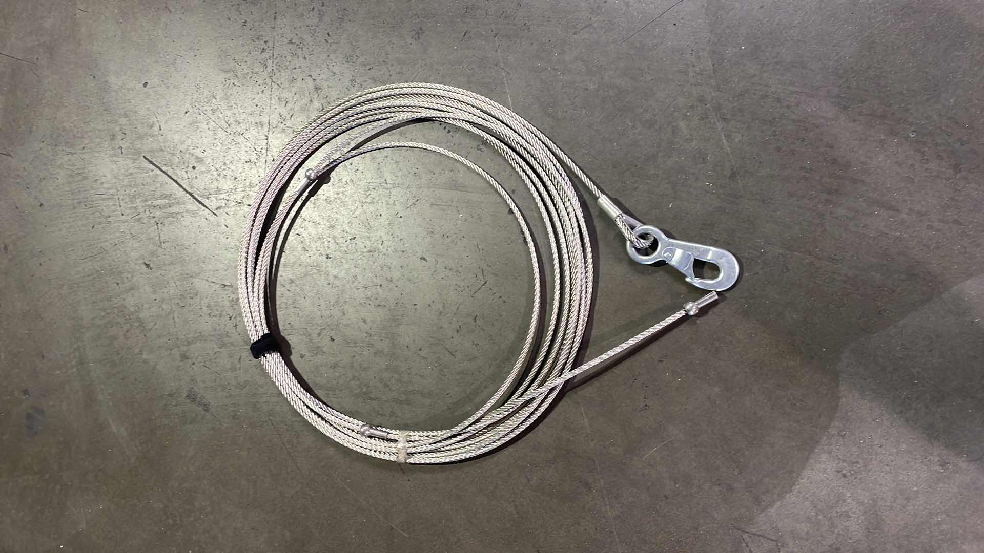 Photo 1 of 5/16” WIRE ROPE WITH HOOK RATED TO 5000LBS UNKNOWN LENGTH