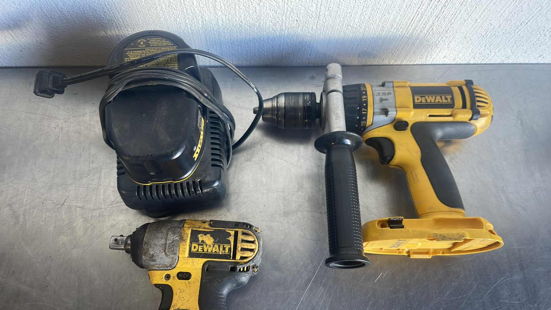 Photo 5 of DEWALT 18v 1/2” HAMMER DRILL DRIVER, 1/2” IMPACT WRENCH, RECIPROCATING SAW WITH CHARGER AND BATTERY