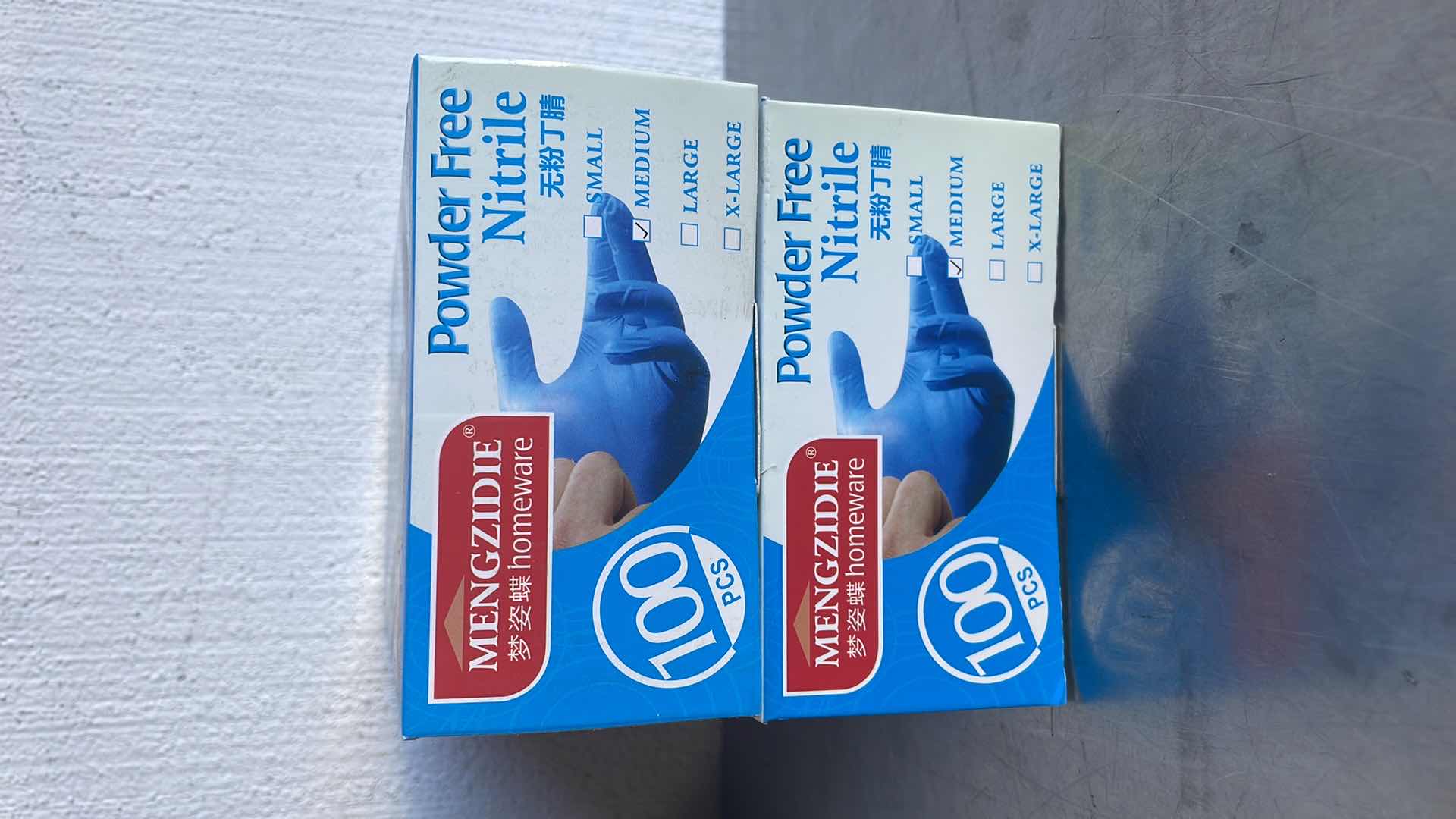 Photo 2 of NITRILE POWDER FREE BLUE DISPOSABLE GLOVES MEDIUM