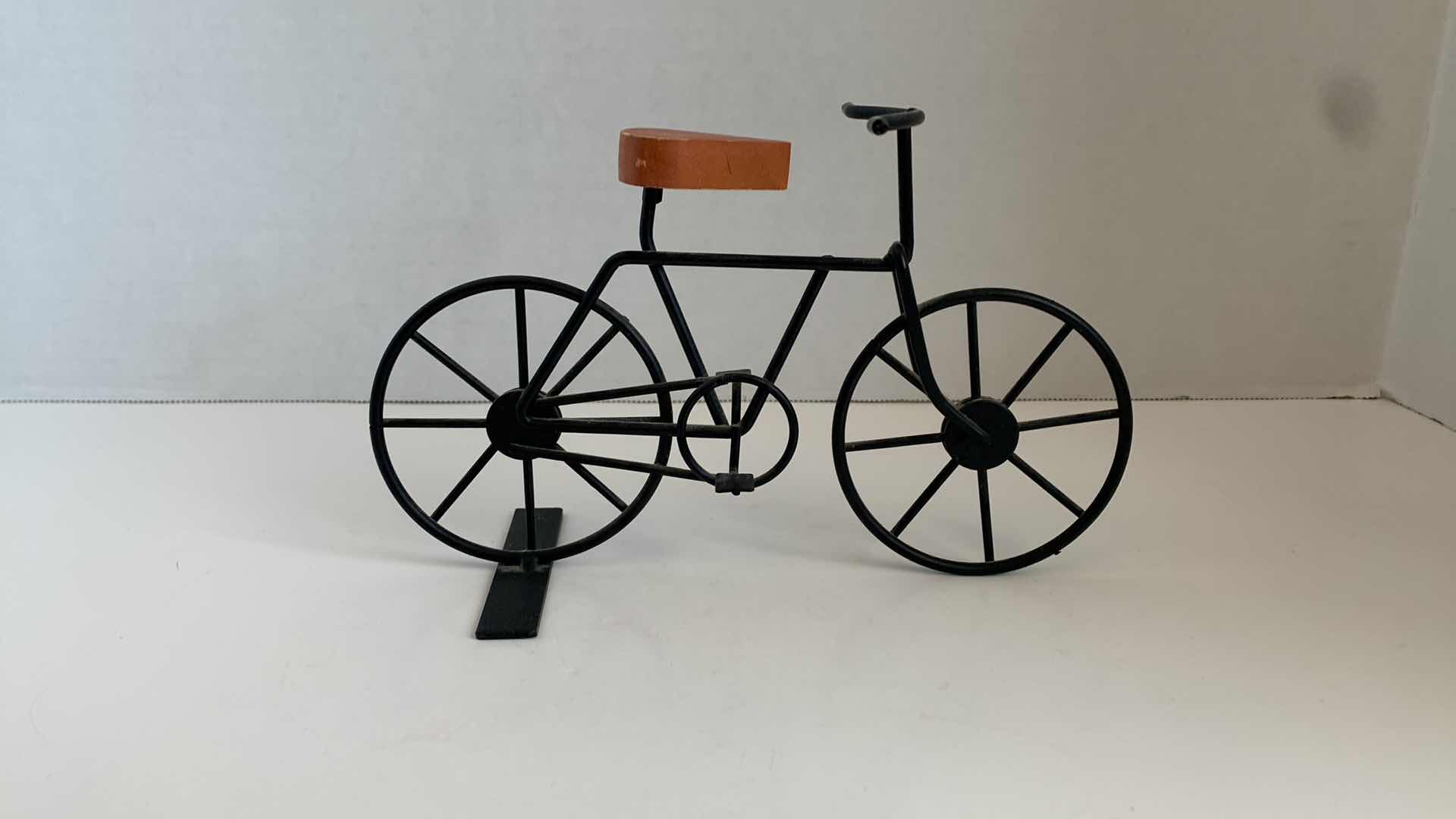 Photo 2 of SET OF 2 METAL BICYCLES WITH WOODEN SEATS TALLEST 5"