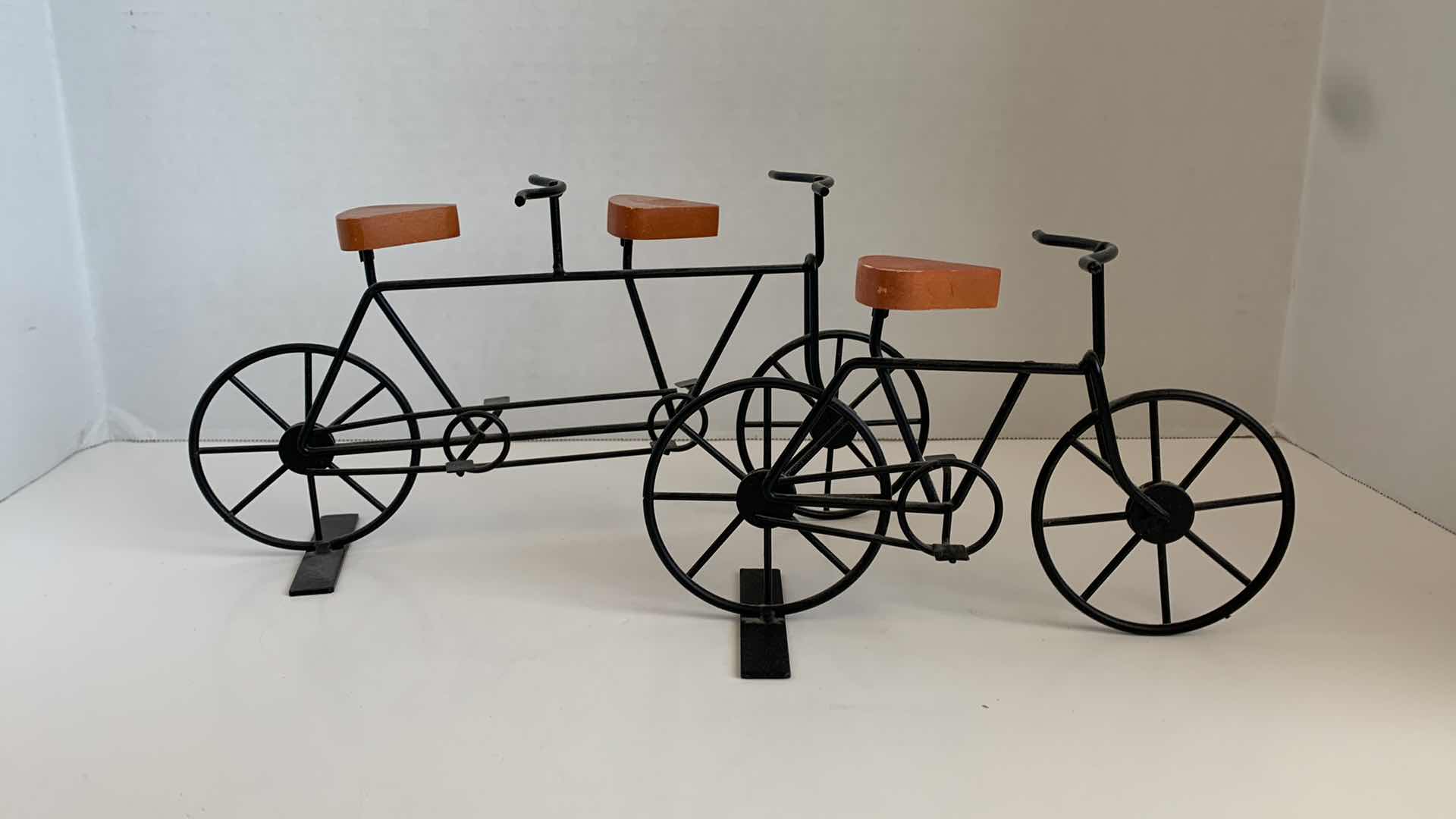 Photo 1 of SET OF 2 METAL BICYCLES WITH WOODEN SEATS TALLEST 5"