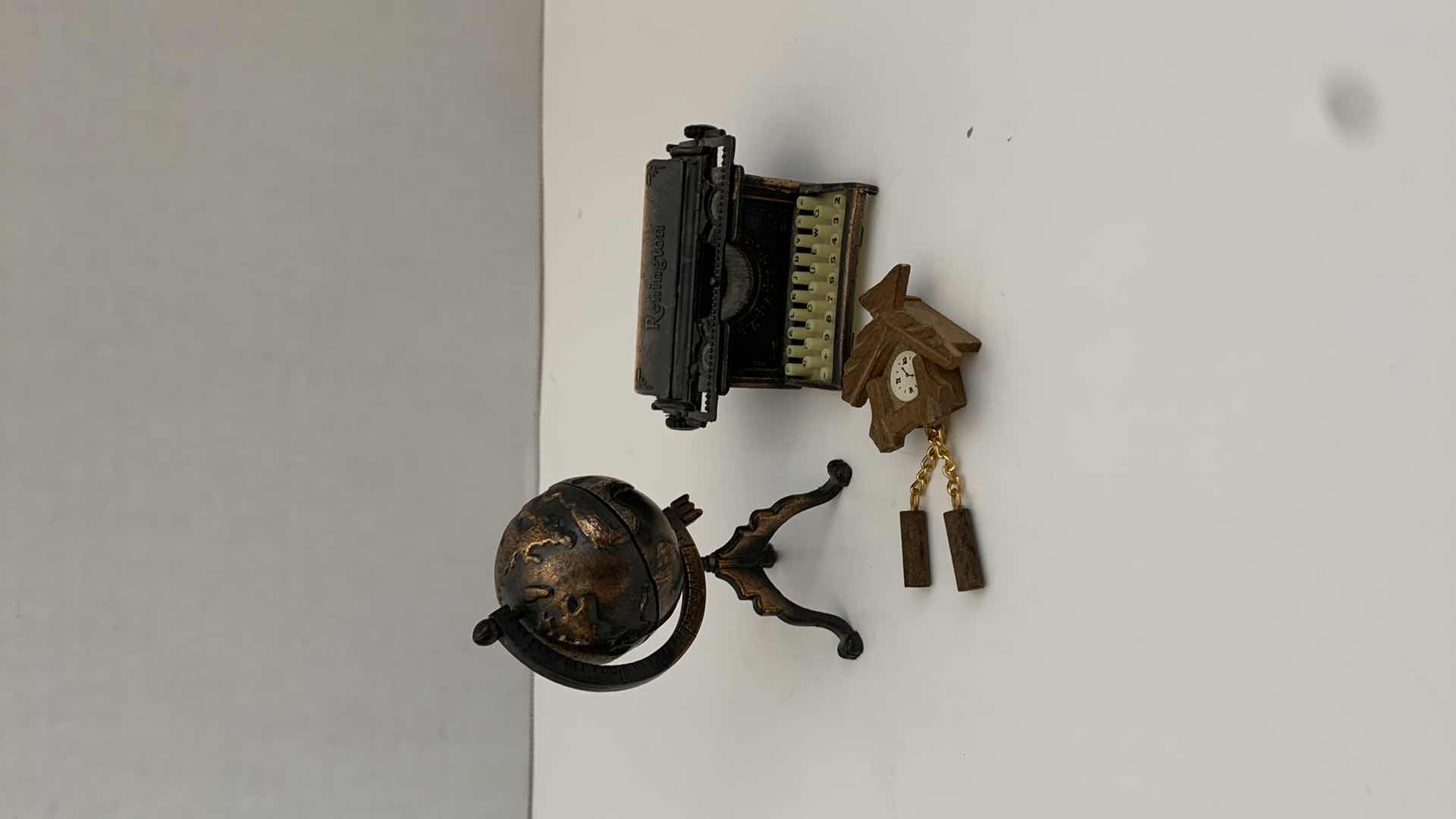 Photo 1 of SET OF 2 METAL STATUES: GLOBE AND TYPEWRITER WITH WOODEN CLOCK TALLEST 3"