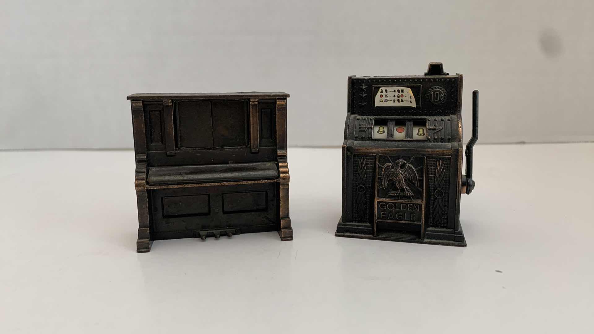 Photo 1 of SET OF 2 METAL STATUES: SLOT MACHINE AND PIANO TALLEST 2"