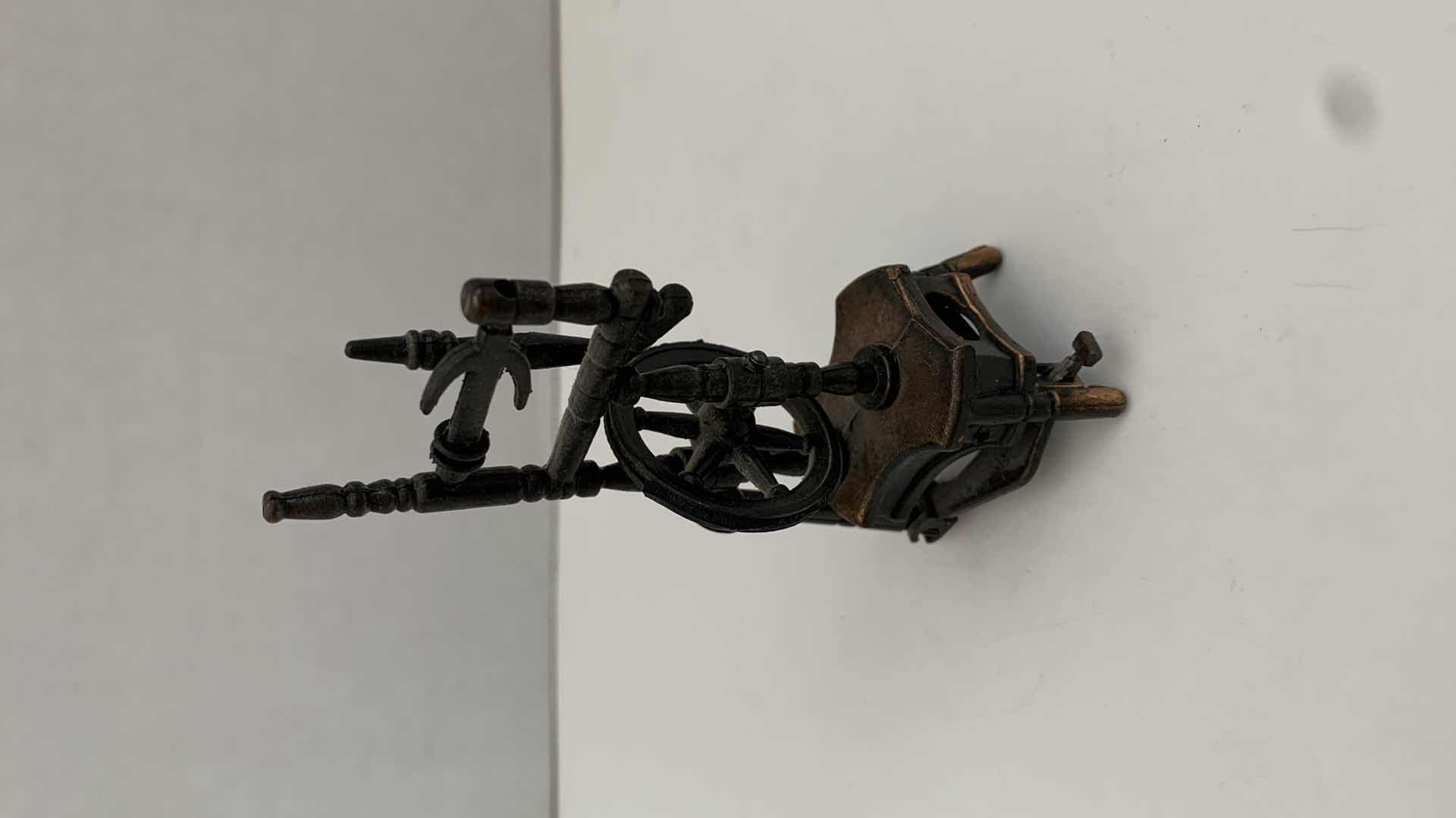 Photo 2 of SET OF 2 METAL STATUES: SPINNING WHEEL PENCIL SHARPENER AND CLOTHING MANGLE TALLEST 4"