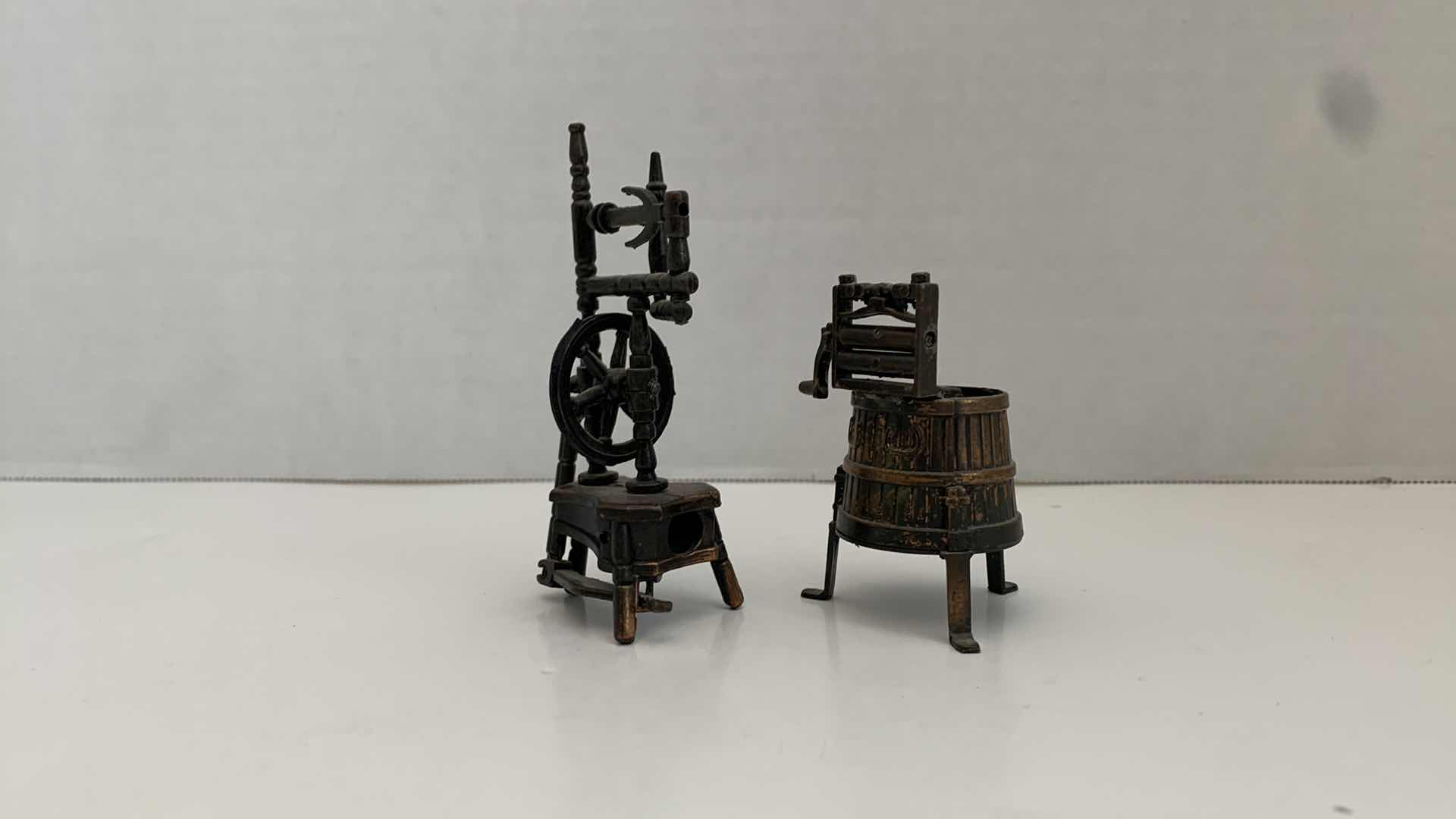 Photo 1 of SET OF 2 METAL STATUES: SPINNING WHEEL PENCIL SHARPENER AND CLOTHING MANGLE TALLEST 4"