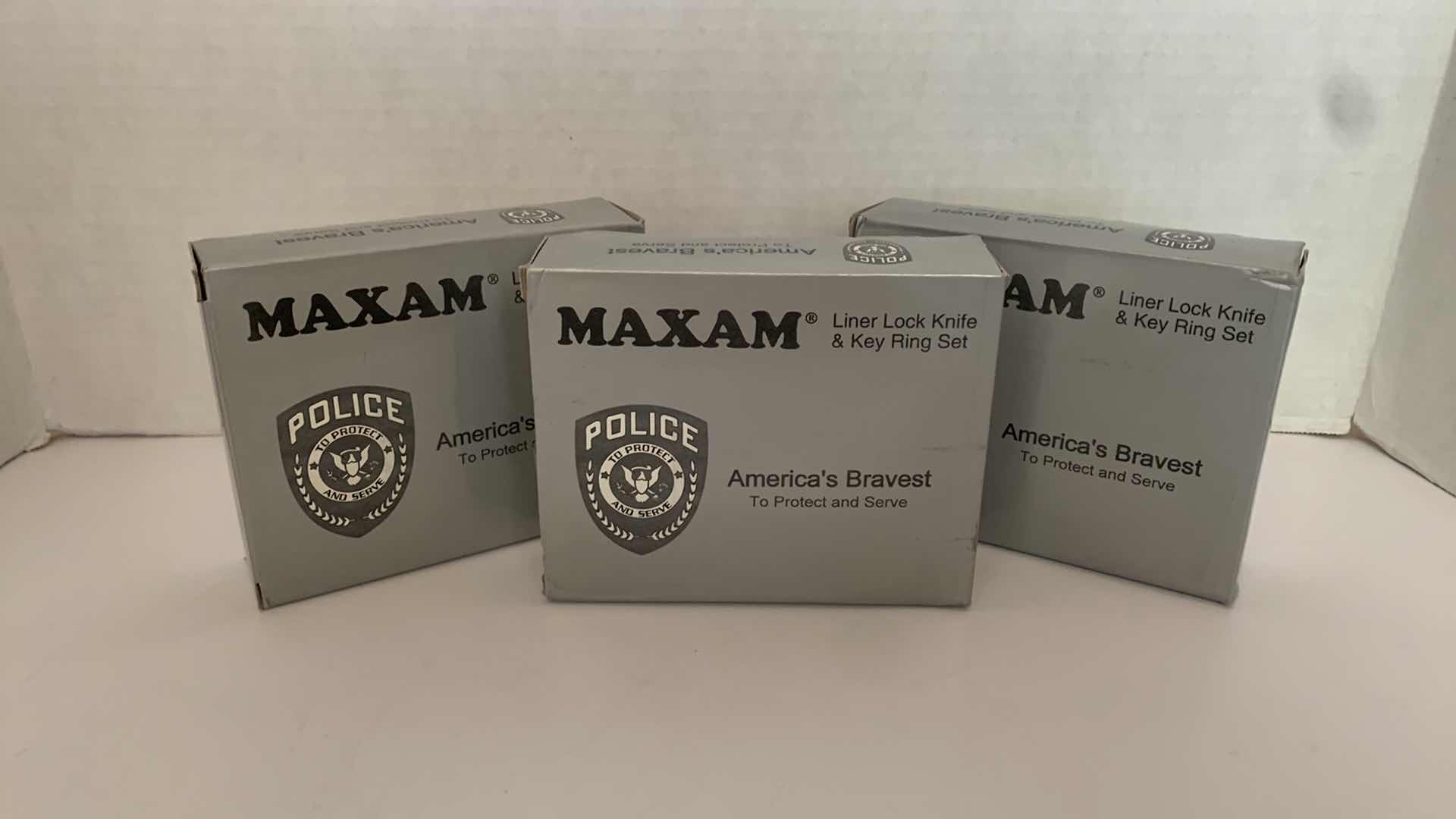 Photo 1 of SET OF 3 MAXAM LINER LOCK KNIFE AND KEY RING POLICE SETS