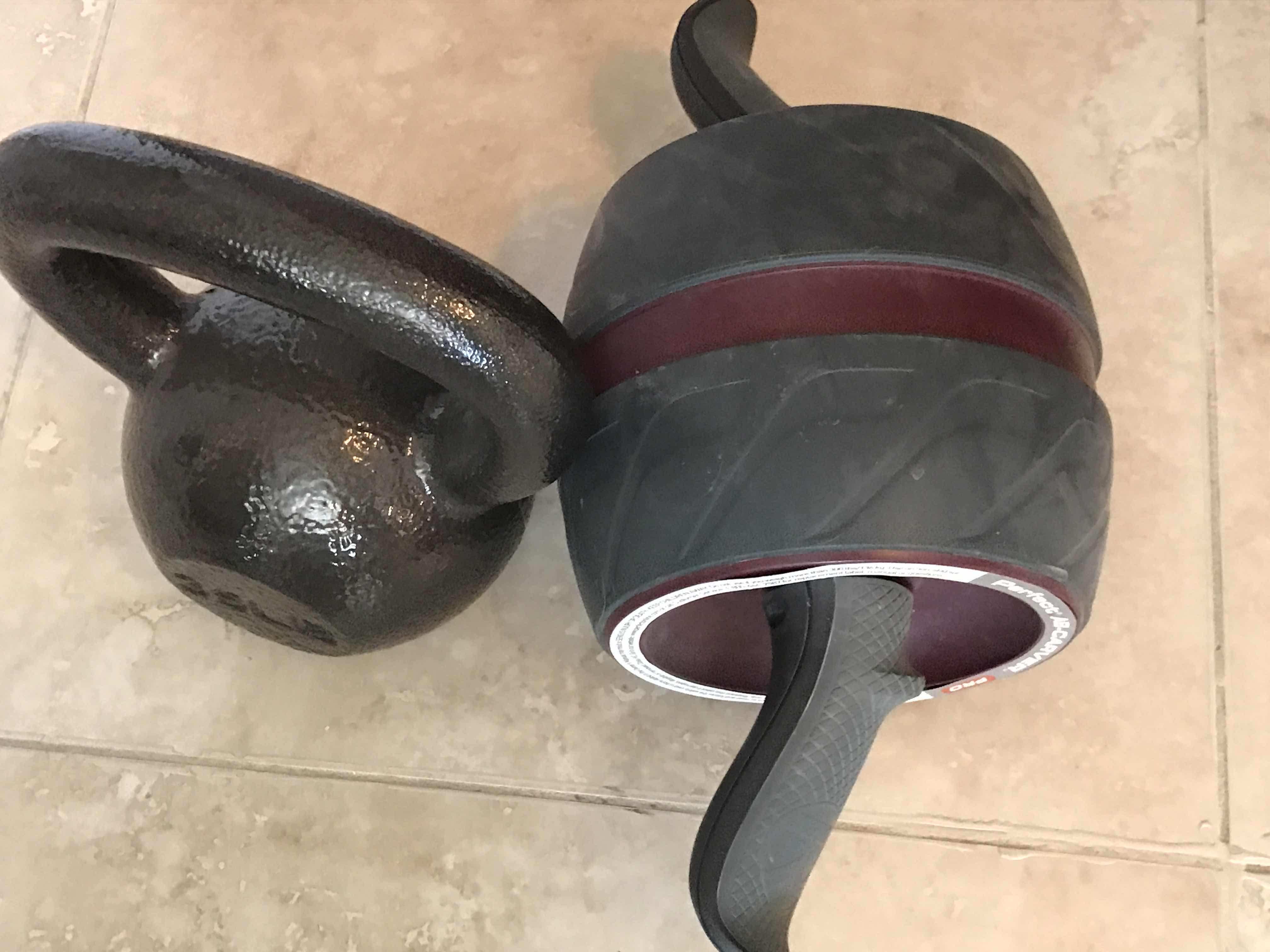 Photo 2 of GYM EQUIPMENT KETTLE BALL AND AB ROLLER