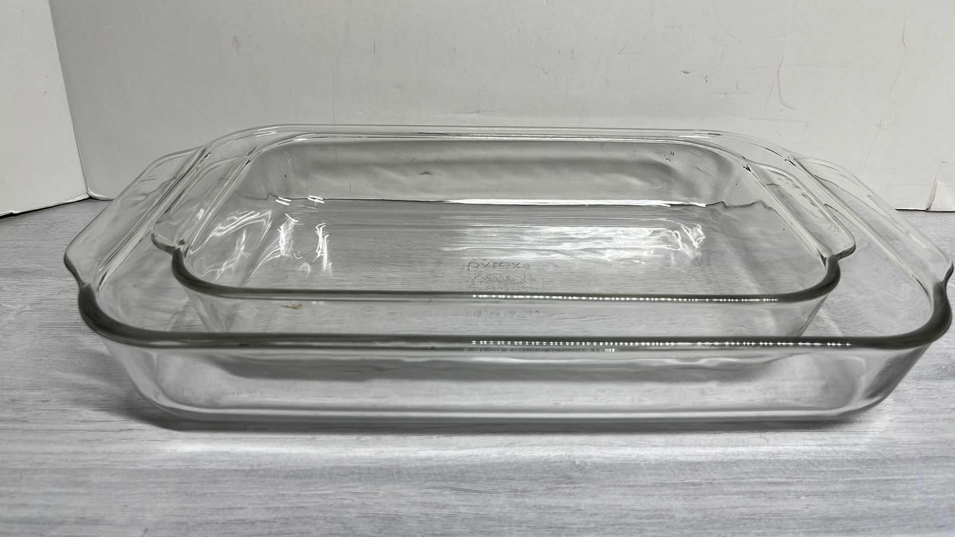 Photo 1 of PYREX CLEAR RECTANGULAR BAKING DISHES W HANDLES 2QT & 3QT (2)