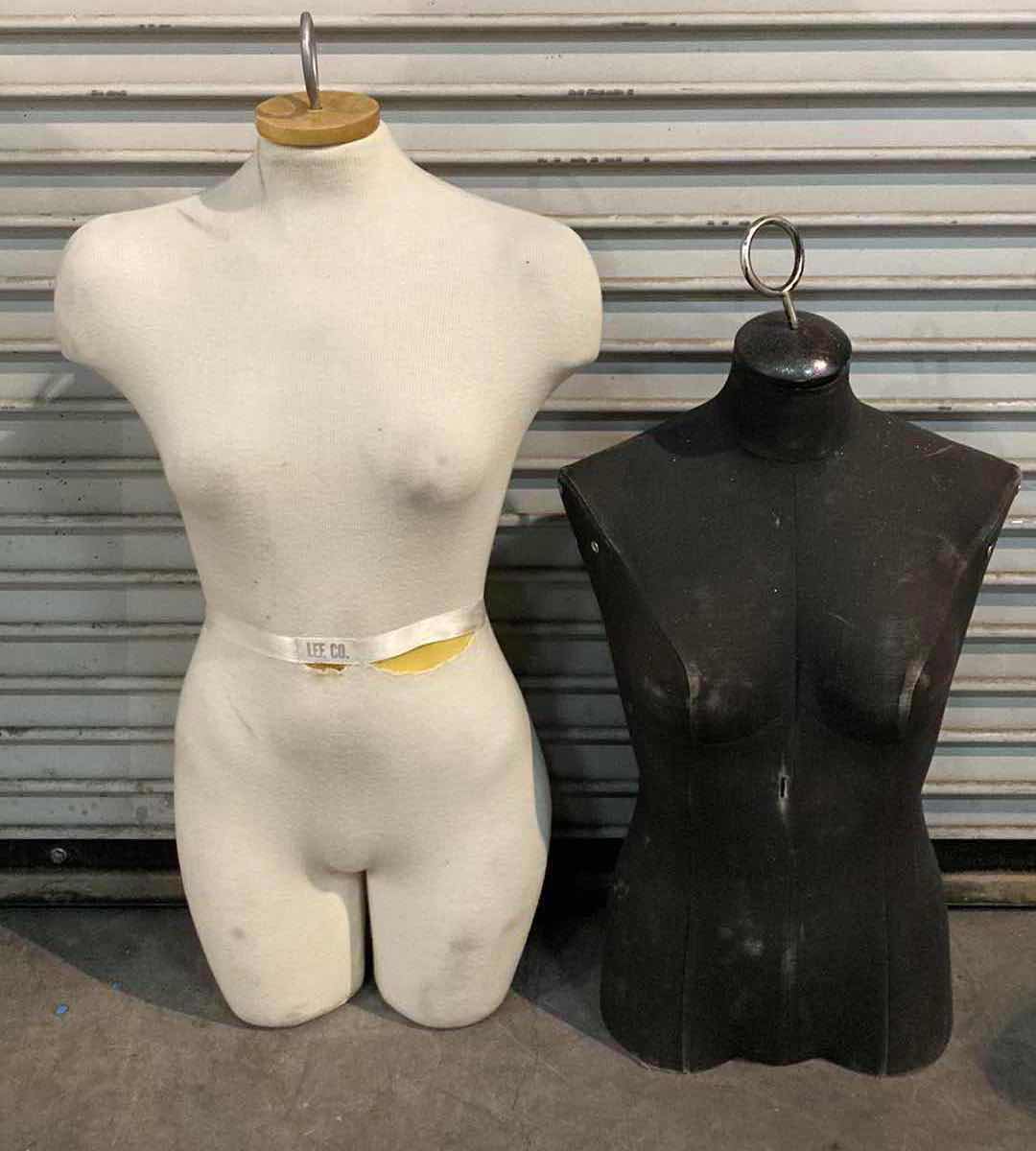 Photo 1 of FEMALE MANNEQUIN BLACK & WHITE FOAM TORSO W FABRIC SLEEVE 15” X 30”-36”