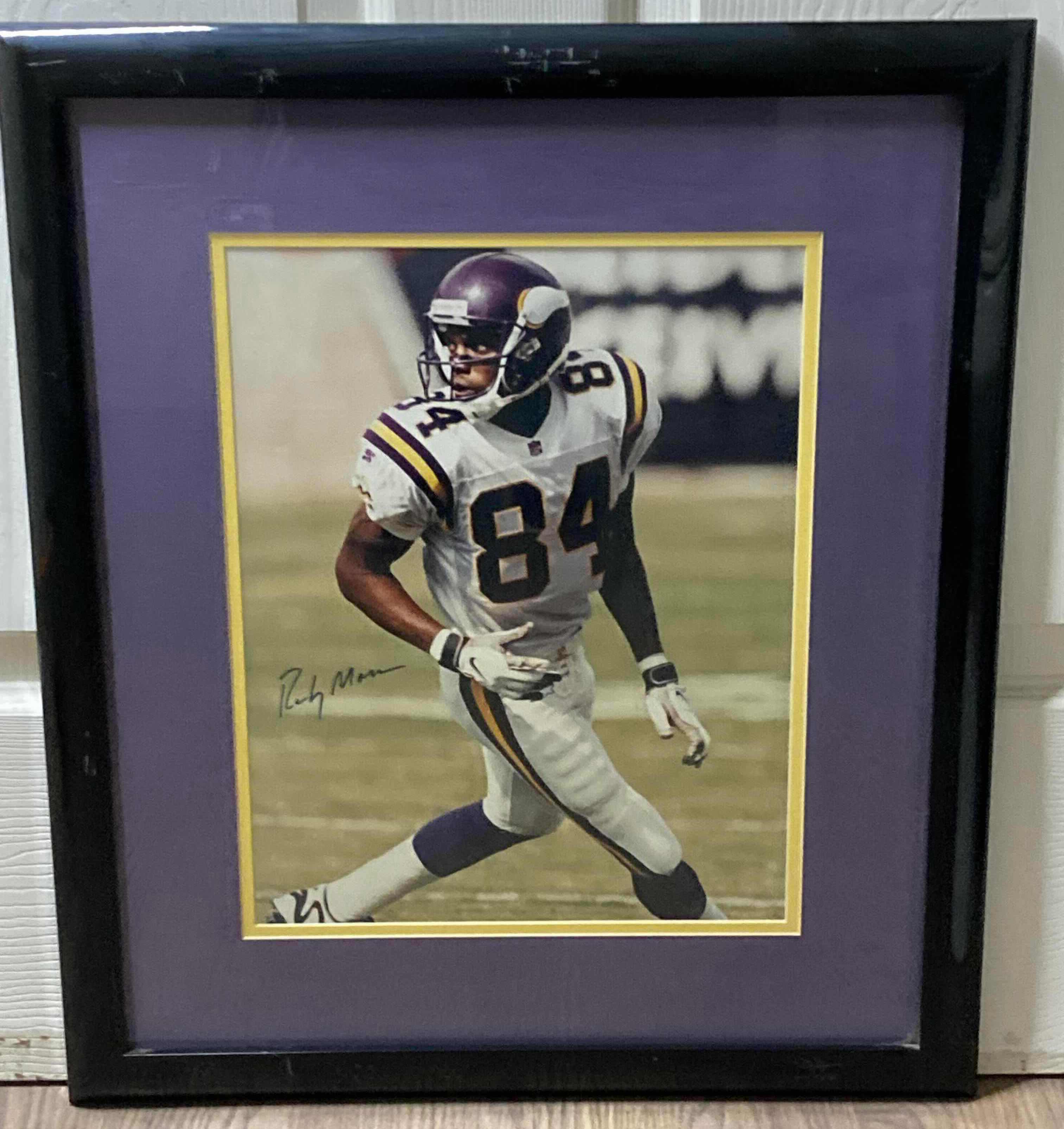 Photo 1 of RANDY MOSS VIKINGS #84 NFL FOOTBALL FRAMED PHOTOGRAPH AUTOGRAPHED BY RANDY MOSS NO COA 19.25” X 22.75”