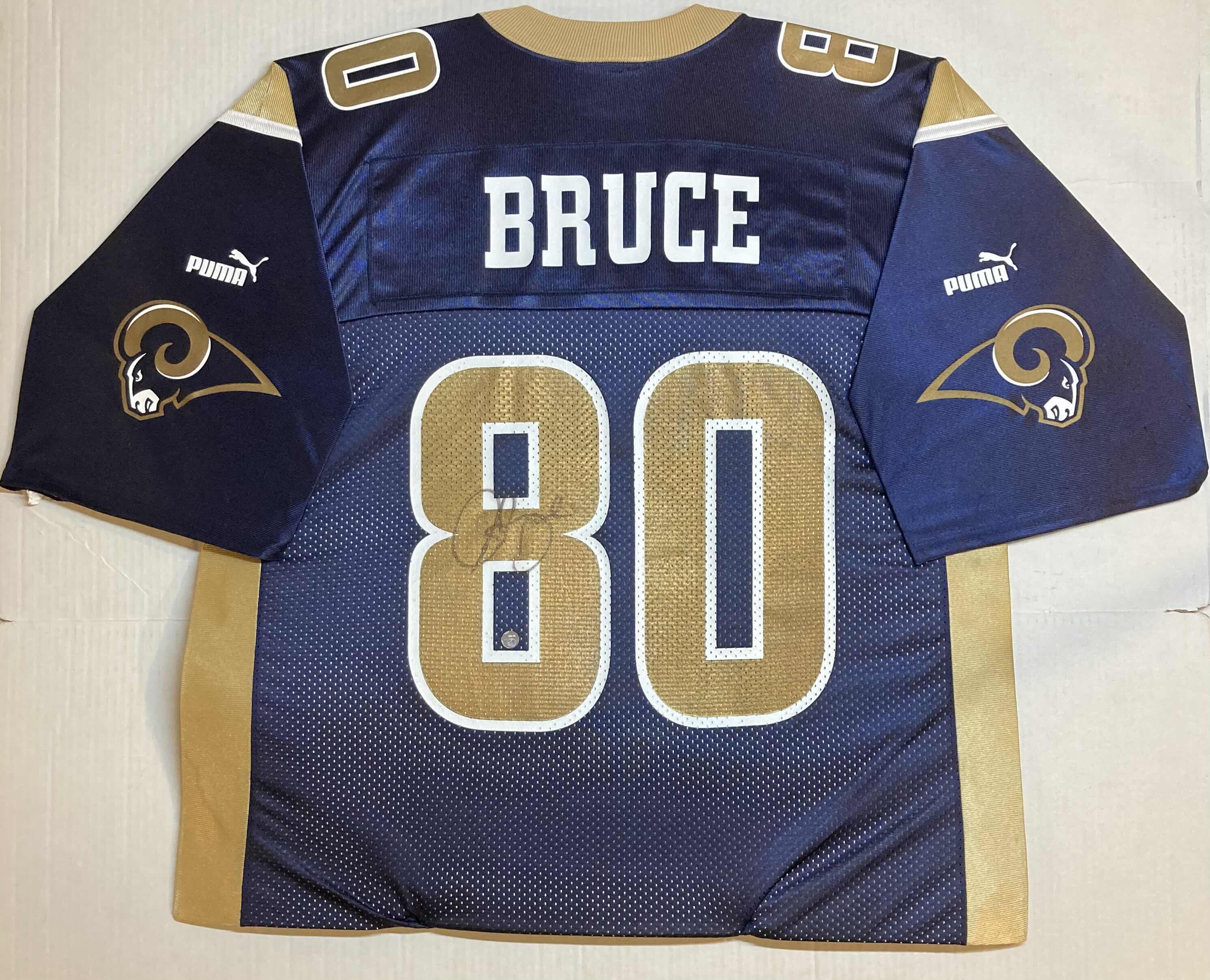 Photo 1 of ISAAC BRUCE ST. LOUIS RAMS #80 DISPLAY JERSEY AUTOGRAPHED BY ISAAC BRUCE NO COA 35.5” X 27.5”