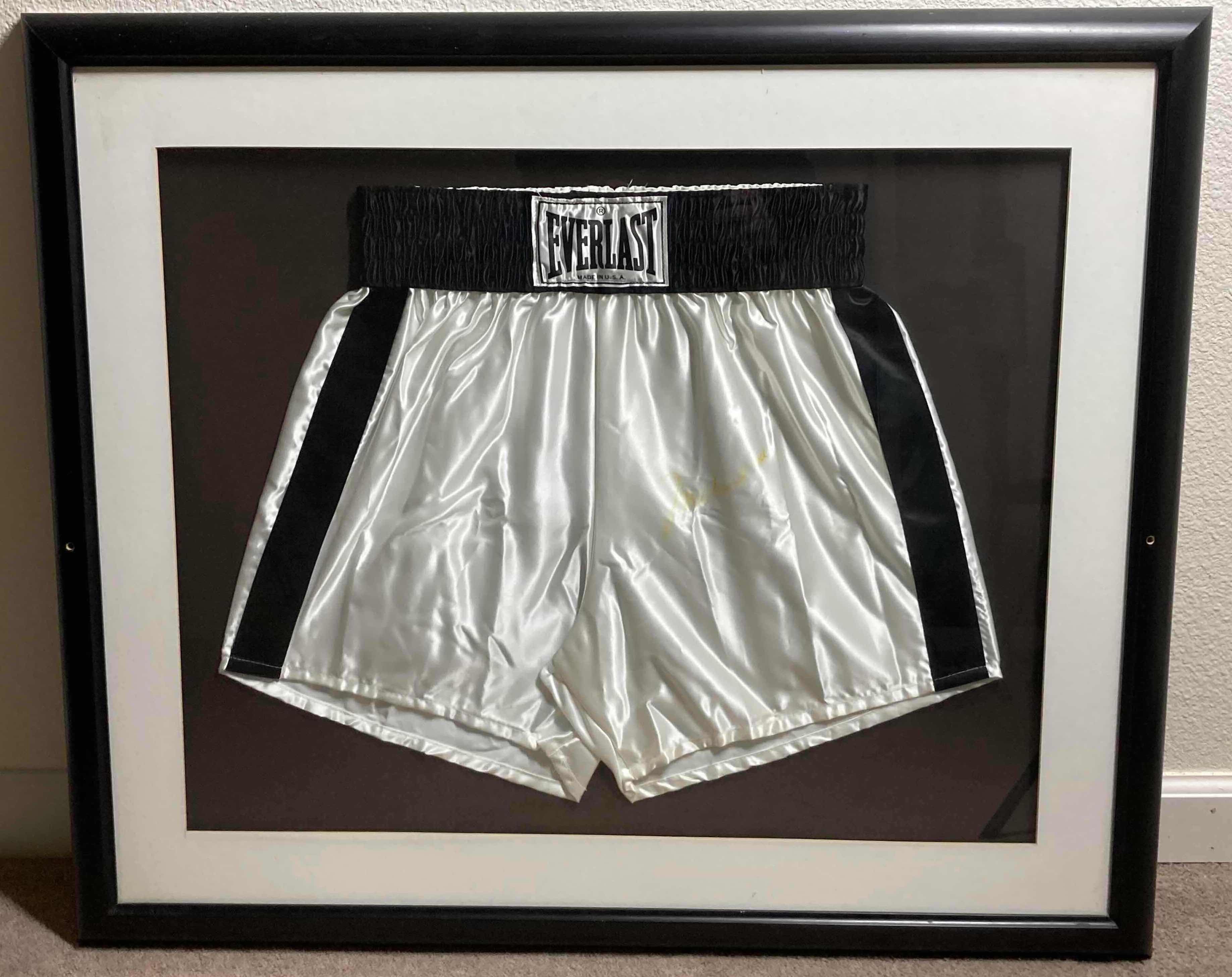 Photo 1 of MOHAMMED ALI FRAMED BOXING EVERLAST SHORTS AUTOGRAPHED BY MOHAMMED ALI NO COA 35” X 29.5”