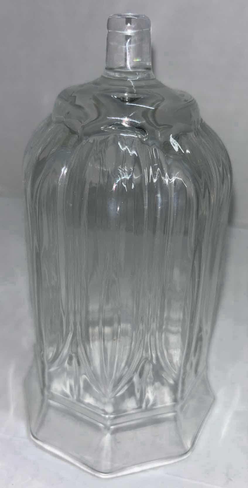 Photo 2 of CLEAR GLASS 5.5” PEG OCTAGON VOTIVE CUPS W CANDLES (4)