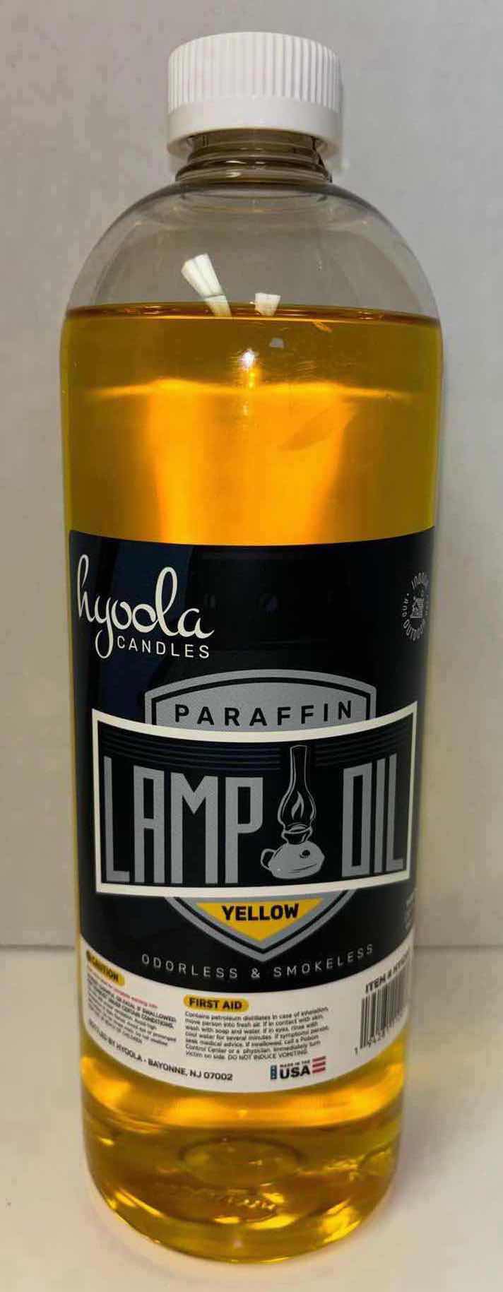 Photo 1 of NEW HYOOLA CANDLES 32 OZ YELLOW PARAFFIN INDOOR/OUTDOOR LAMP OIL, ODORLESS & SMOKELESS