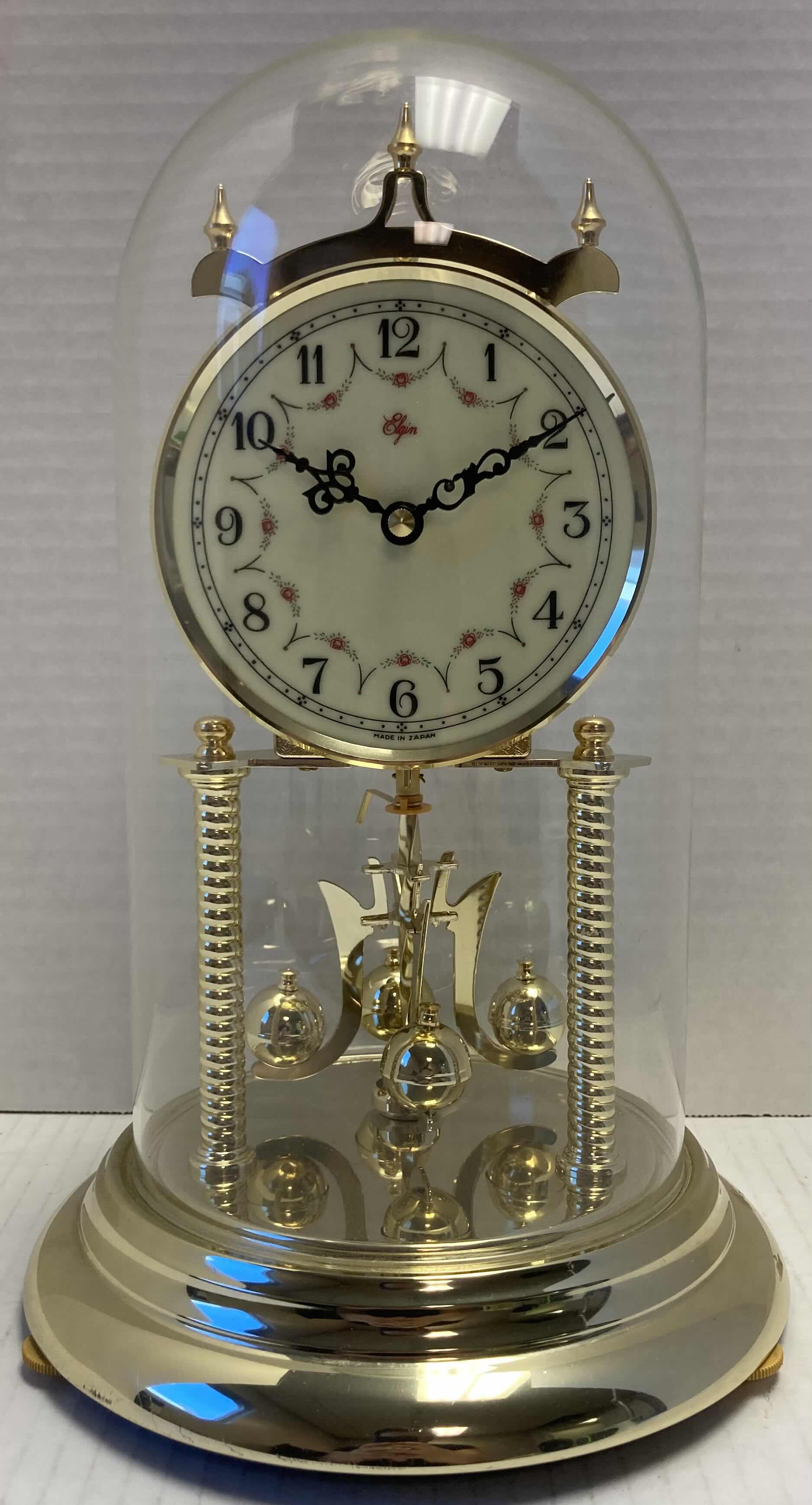 Photo 1 of ELGIN GOLD FINISH ANNIVERSARY JAPANESE BATTERY OPERATED CLOCK W ROTATING PENDULUM 8” X 8” H12”