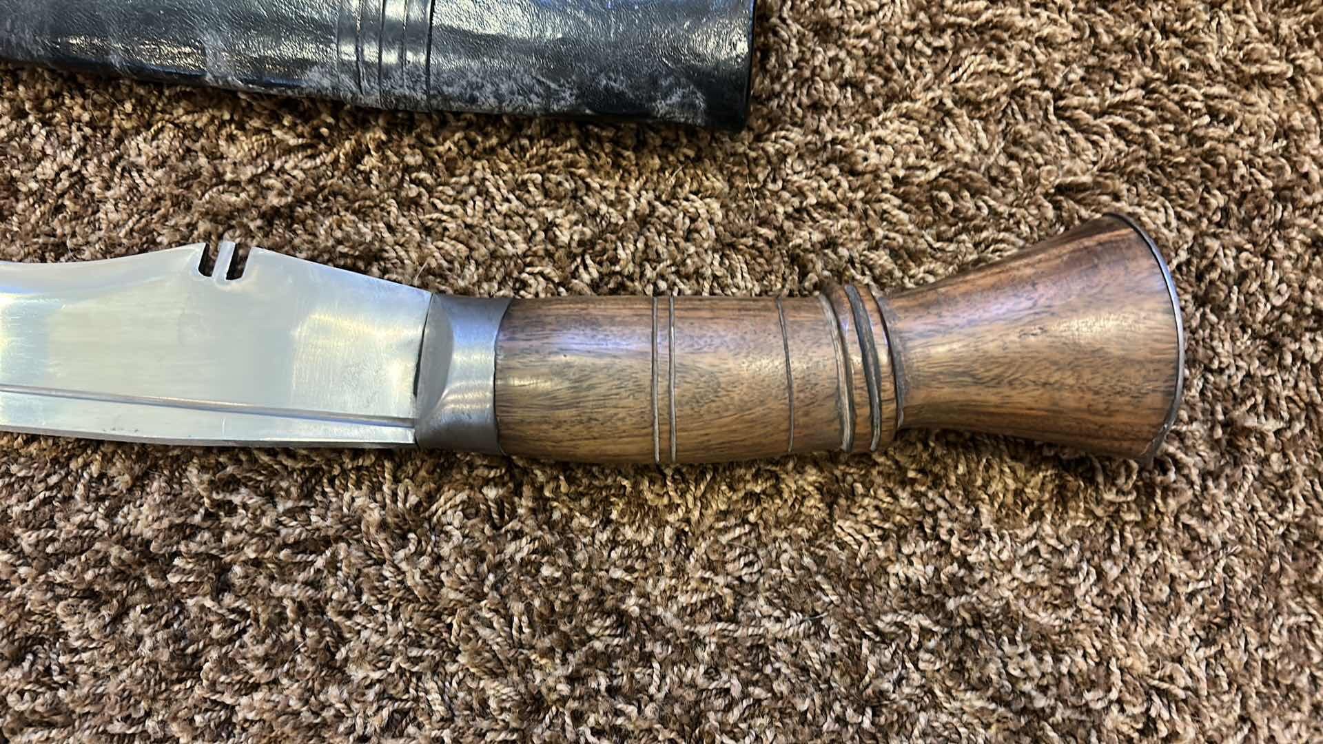 Photo 2 of MACHETE WITH LEATHER AND BRASS SHEATH 31.5” FROM TIP TO HANDLE (BLADE 23.5”)