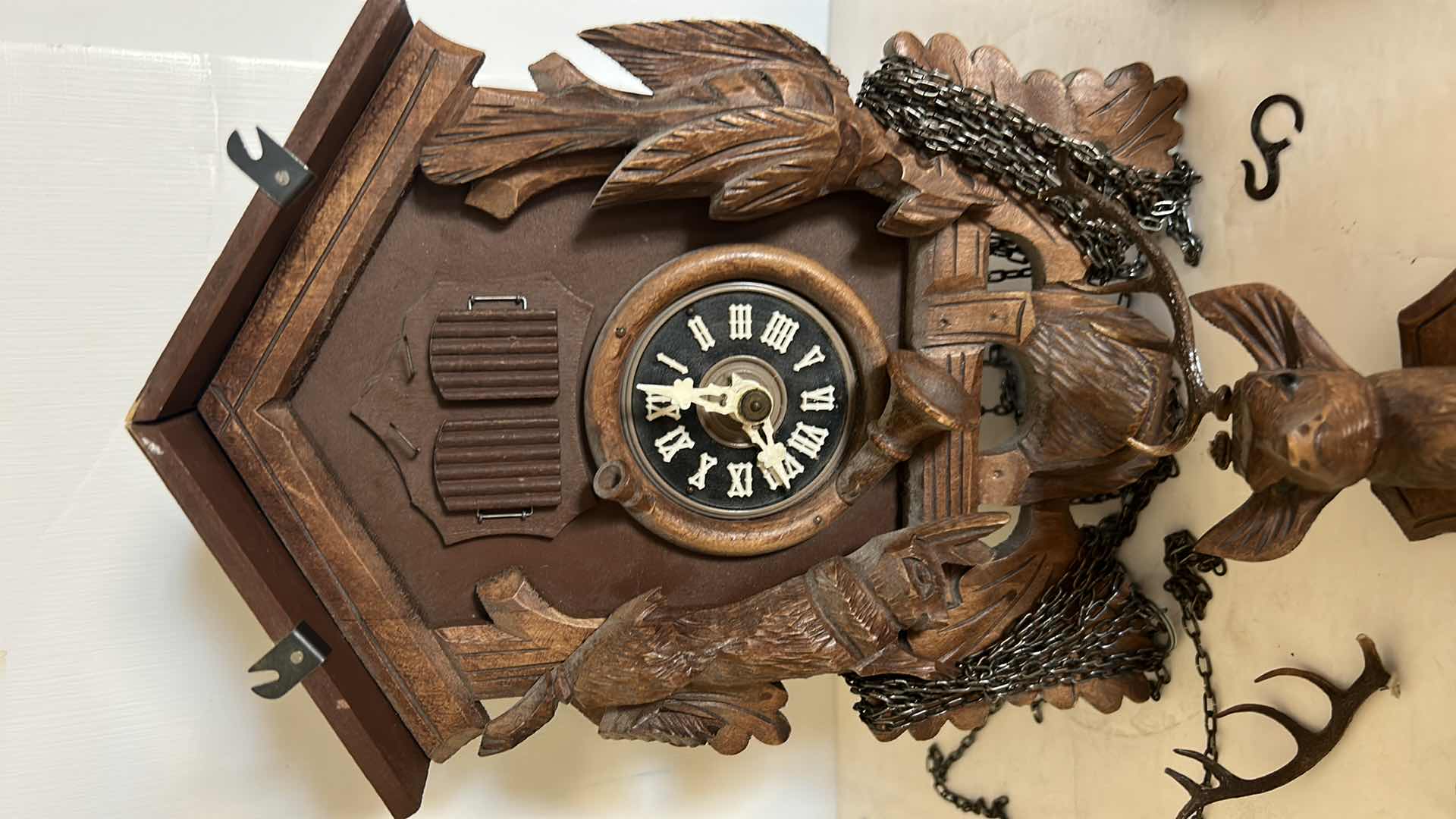 Photo 2 of VINTAGE COO COO CLOCK ( NEEDS GLUING) IN WICKER BASKET
