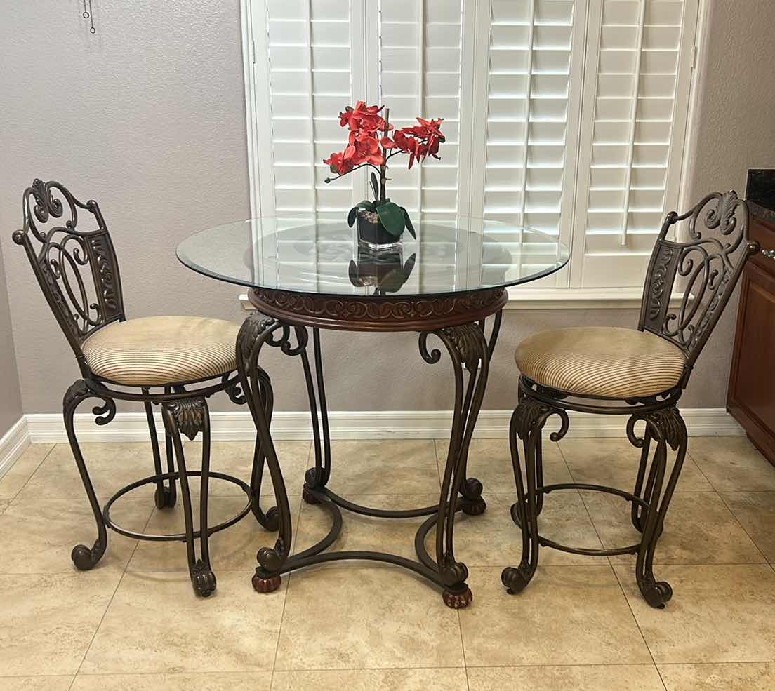 Photo 1 of ASHLEY FURNITURE- WOOD AND HEAVY IRON BAR HEIGHT CAFE TABLE WITH 2 SWIVEL BARSTOOLS 40” ROUND, H3’