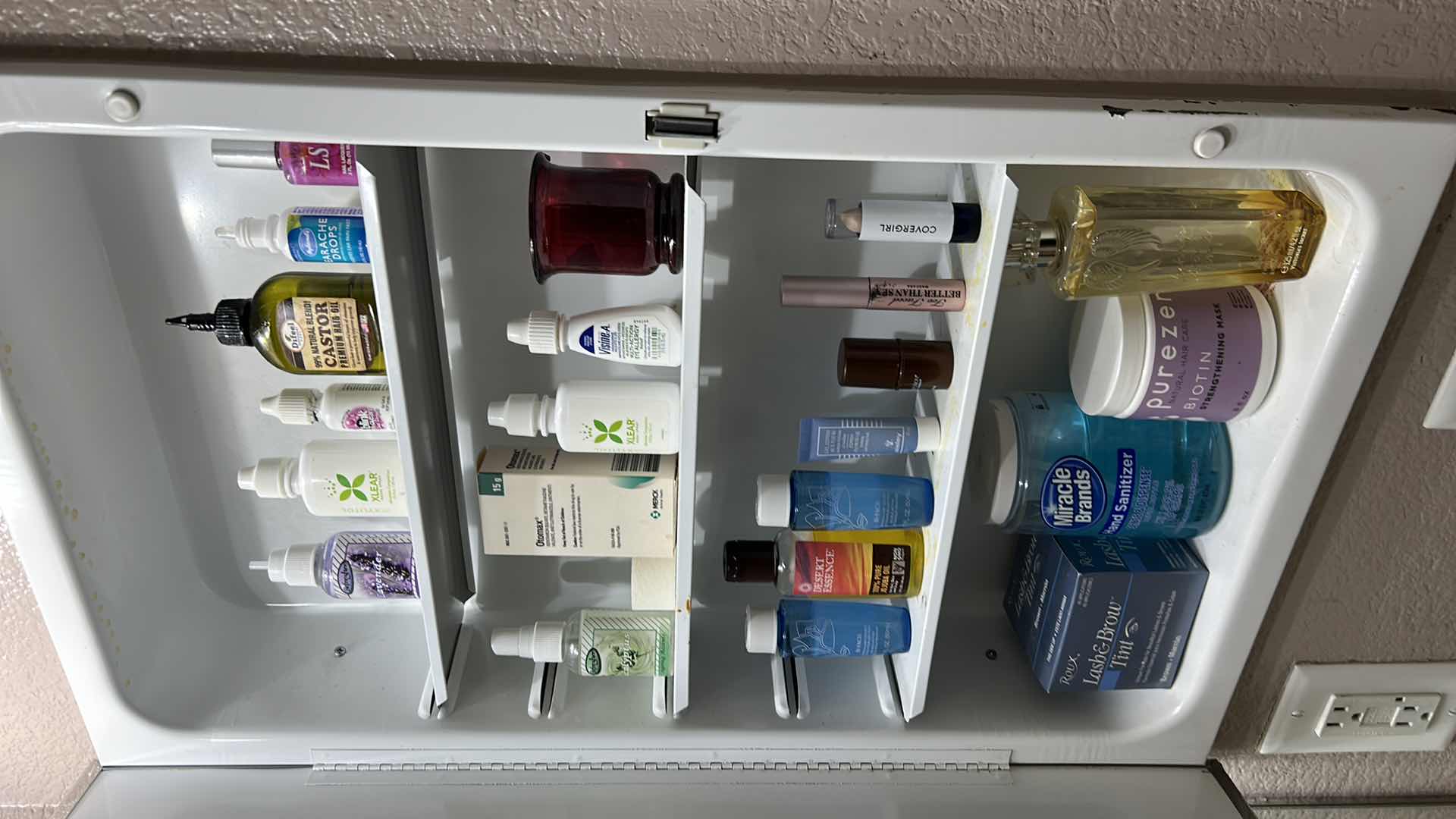 Photo 1 of CONTENTS OF CABINET IN BATHROOM