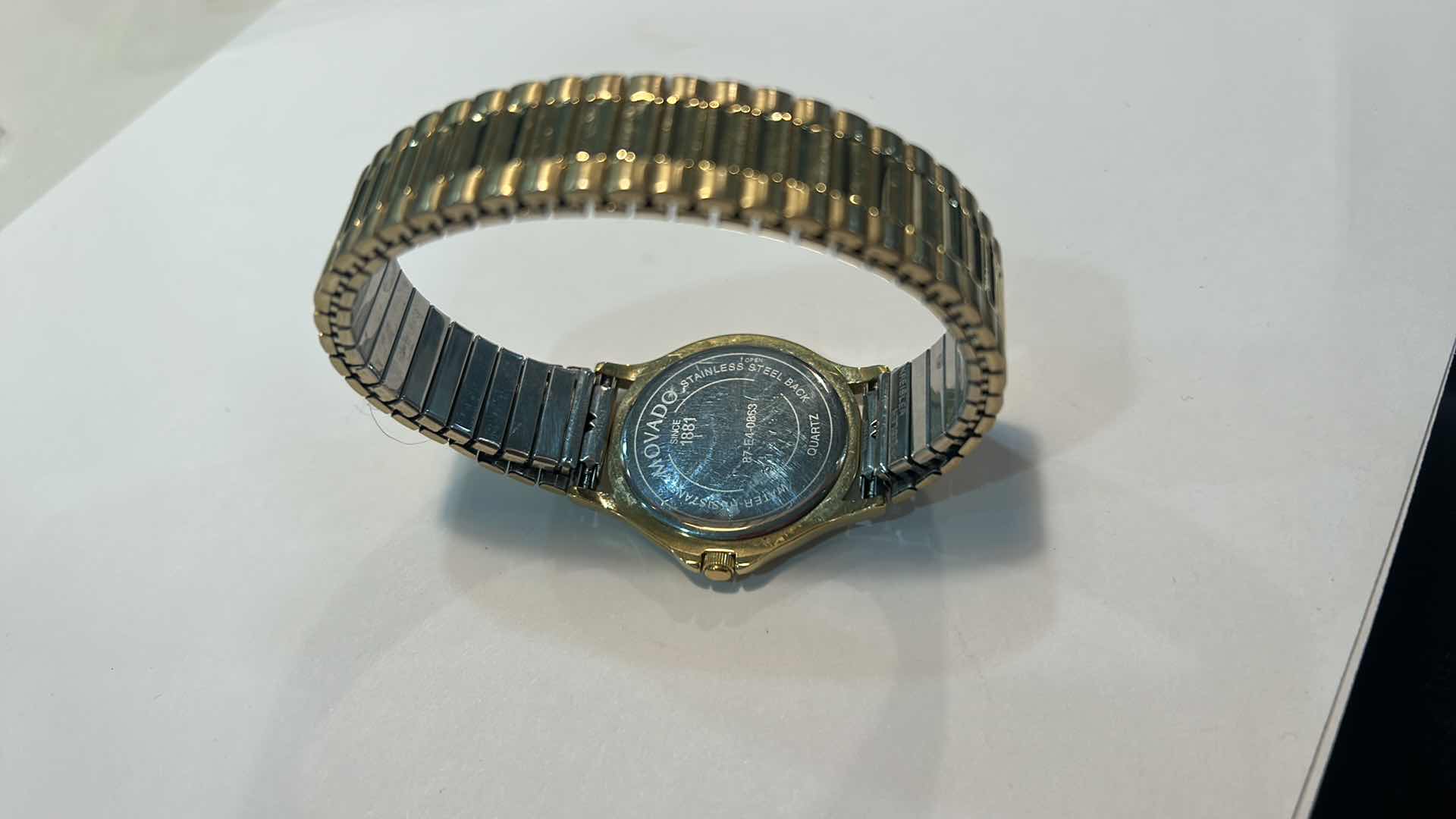 Photo 3 of MENS GOLD MOVADO WATCH (NEEDS BATTERY)