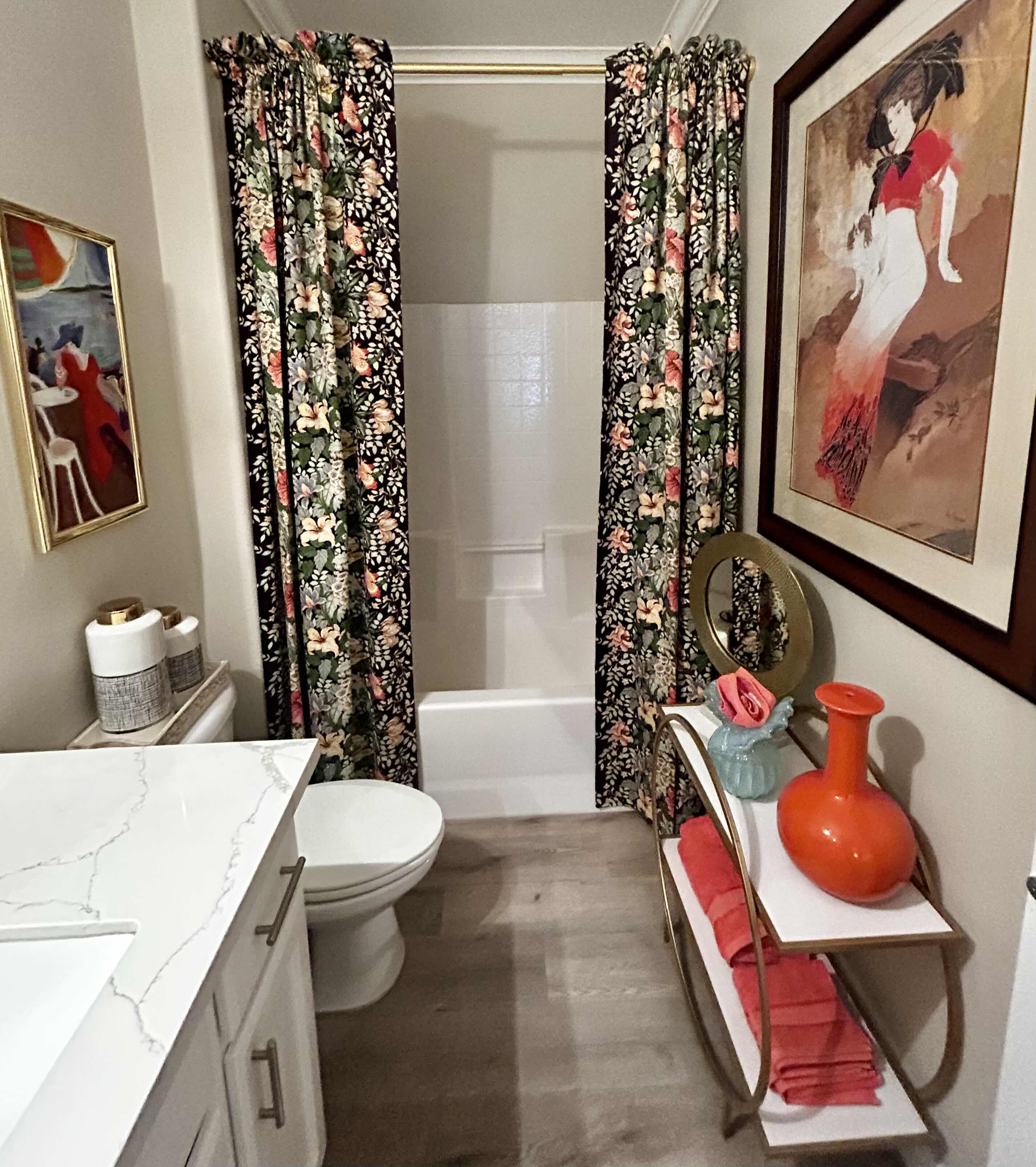 Photo 1 of BATHROOM ENSEMBLE INCLUDES- DRAPERY PANELS, 2 ARTWORK, ORANGE VASE AND GOLD HAMMERED MIRROR ON STAND, 2 BLACK AND WHITE TALL JARS WITH LIDS AND BLUE GLASS VASE (CART NOT INCLUDED) LARGEST FRAMED ARTWORK 3’ x 46”