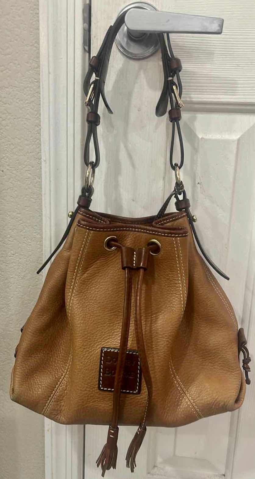 Photo 1 of LEATHER DOONEY & BOURKE DRAWSTRING BUCKET HANDBAG