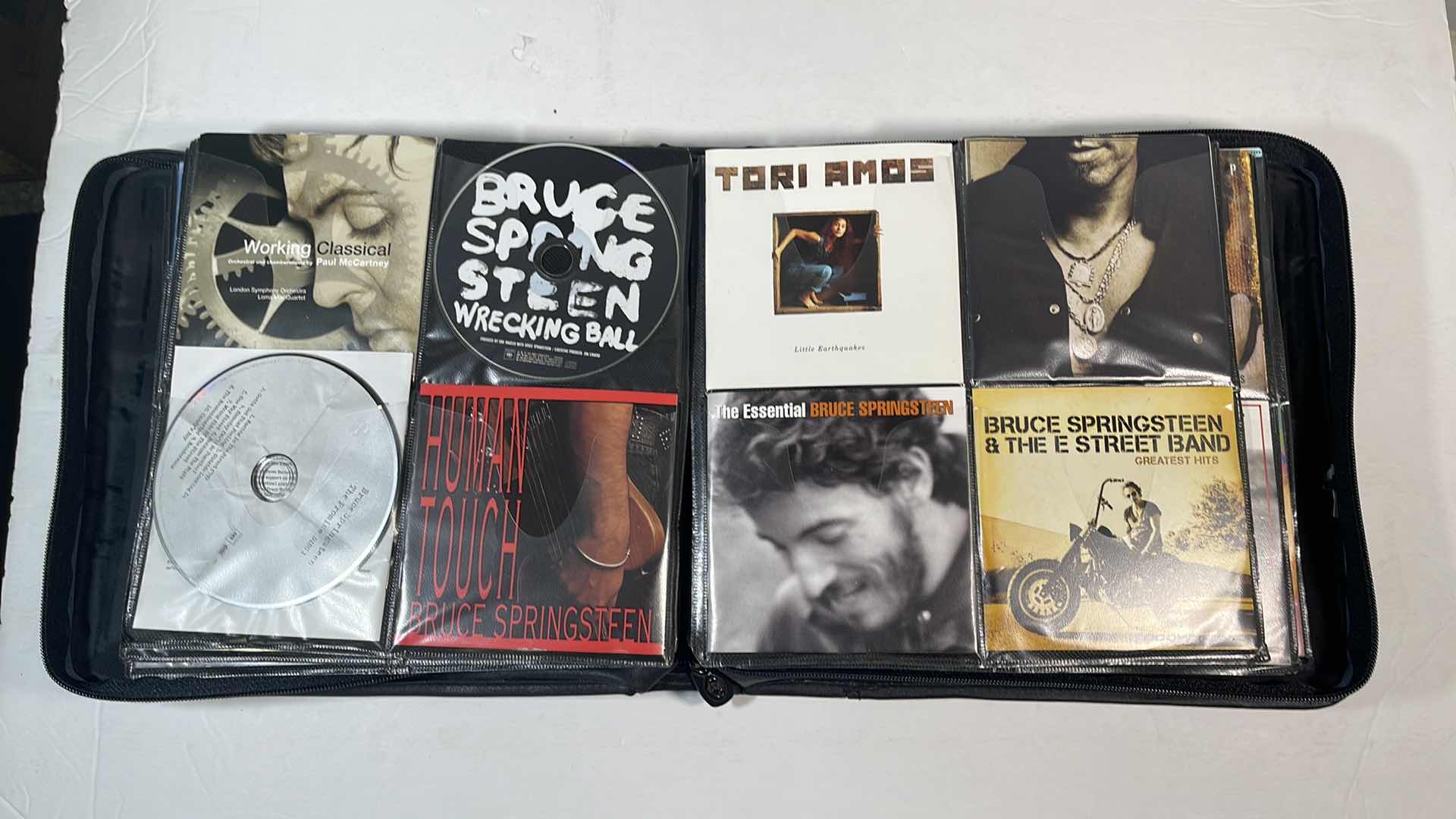 Photo 4 of ASSORTED MUSIC CDS & BODY GLOVE CARRY CASE