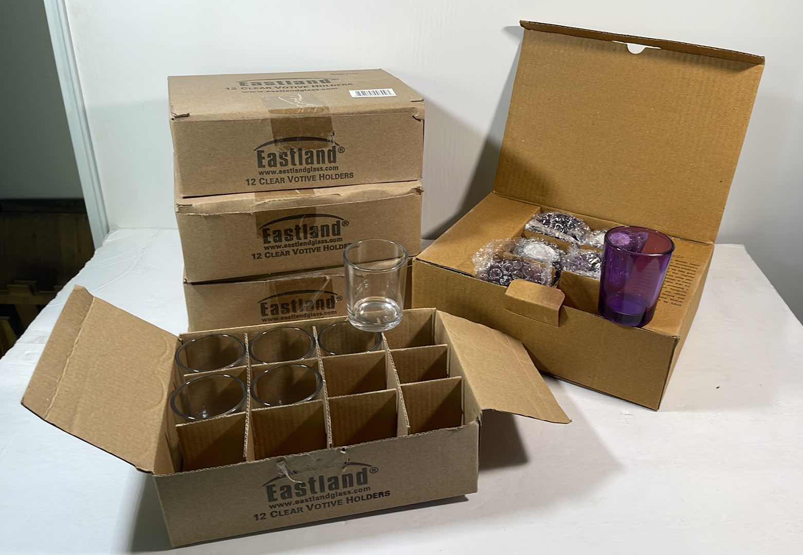 Photo 1 of VOTIVE CANDLE HOLDERS 3.5 CASES EASTLAND CLEAR & ONE CASE HOSLEY PURPLE H2.5”