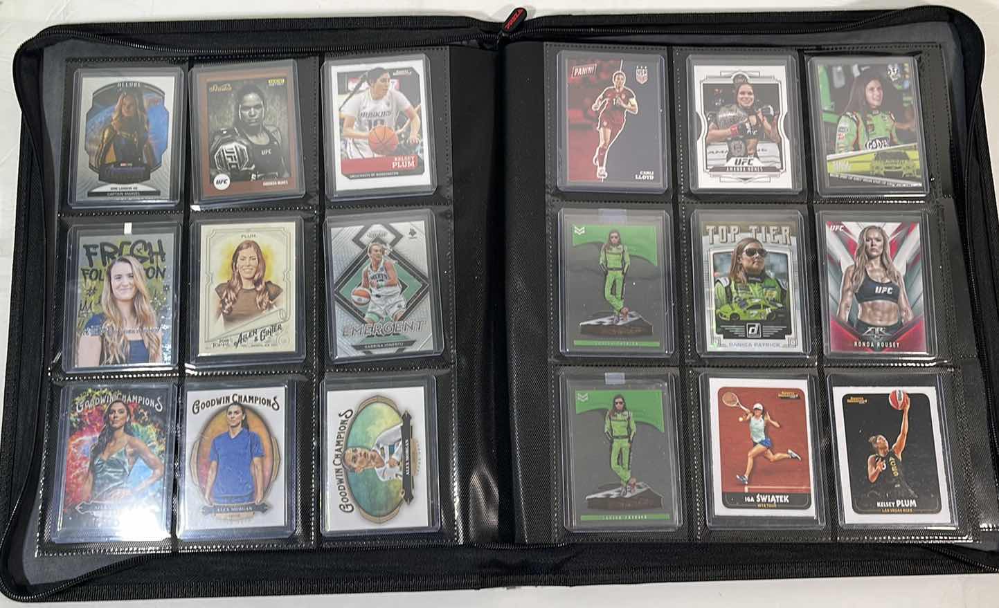 Photo 1 of ASSORTED SPORTS TRADING CARDS IN FOLDER CASE