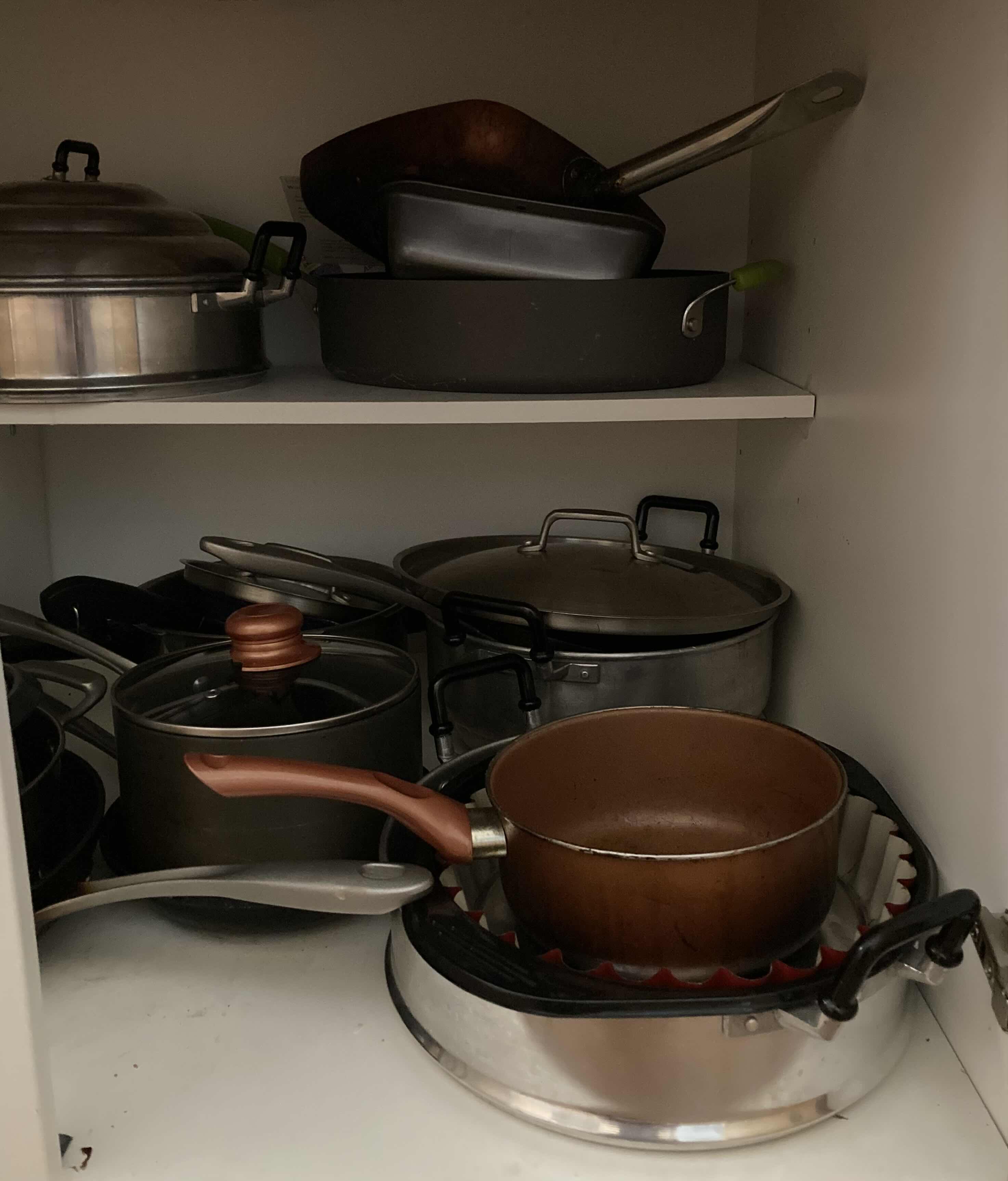 Photo 1 of CONTENTS OF CABINET-POTS & PANS