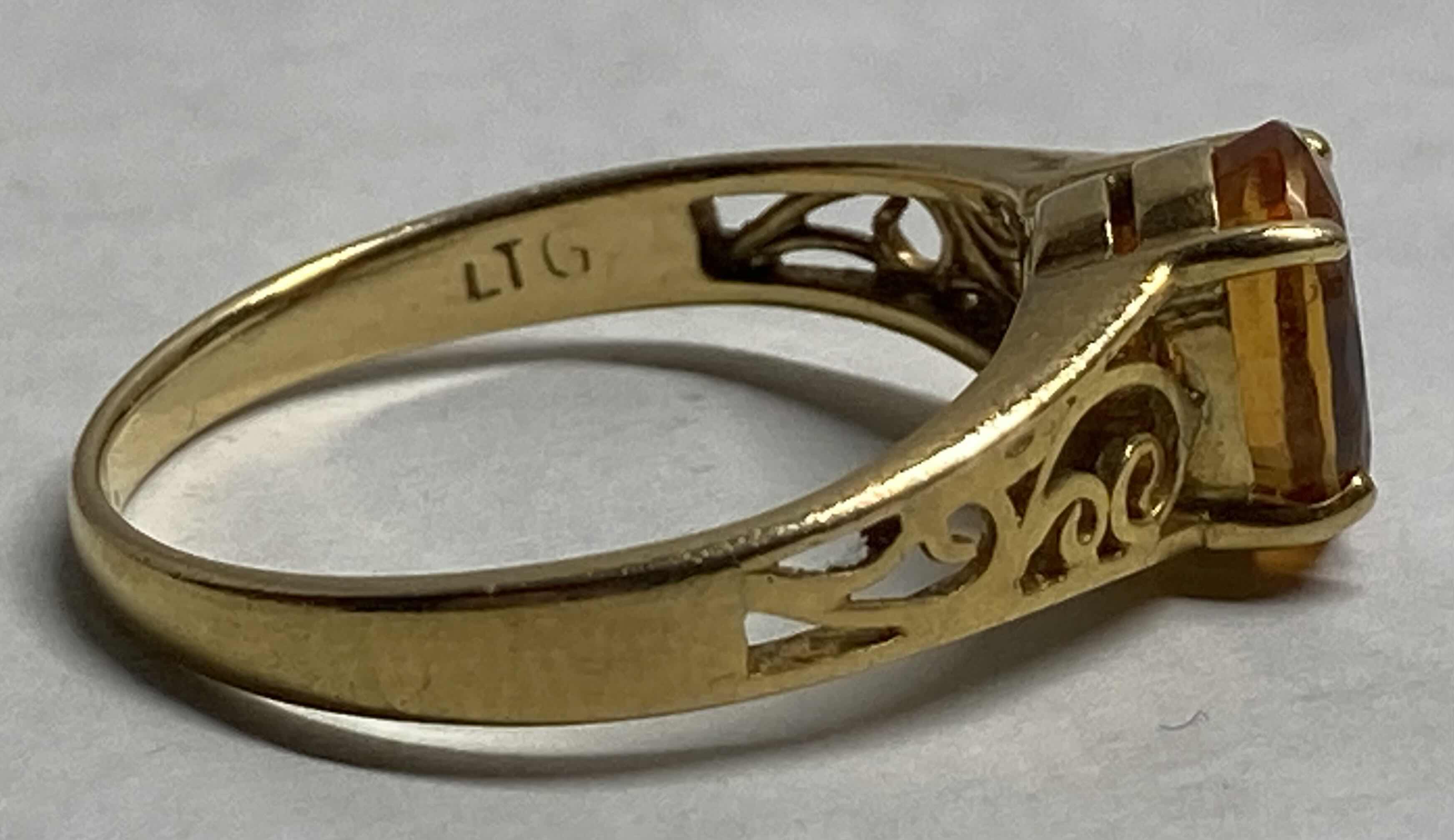 Photo 1 of GOLD RING WITH GOLD STONE APPROX RING SIZE 7-7.5