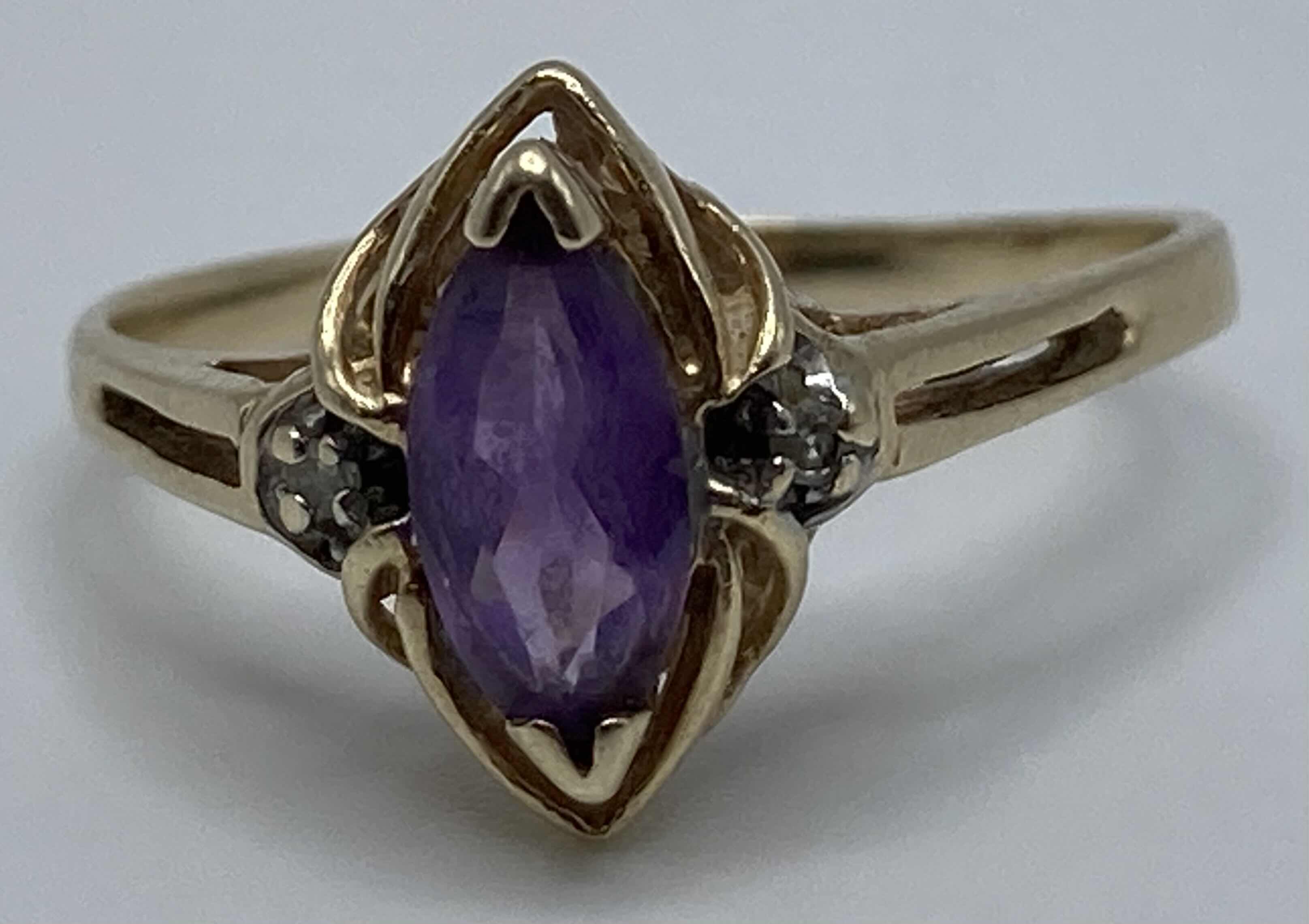 Photo 1 of GOLD RING W PURPLE STONE APPROX RING SIZE 8.5-9