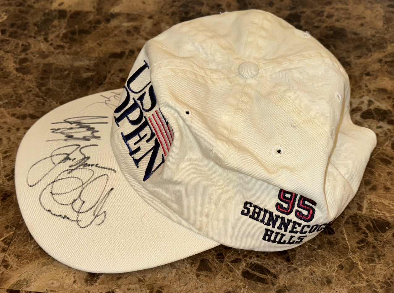 Photo 1 of GOLF ACCESSORIES- BALLS, TEES, BANKS, GAME & SIGNED HAT