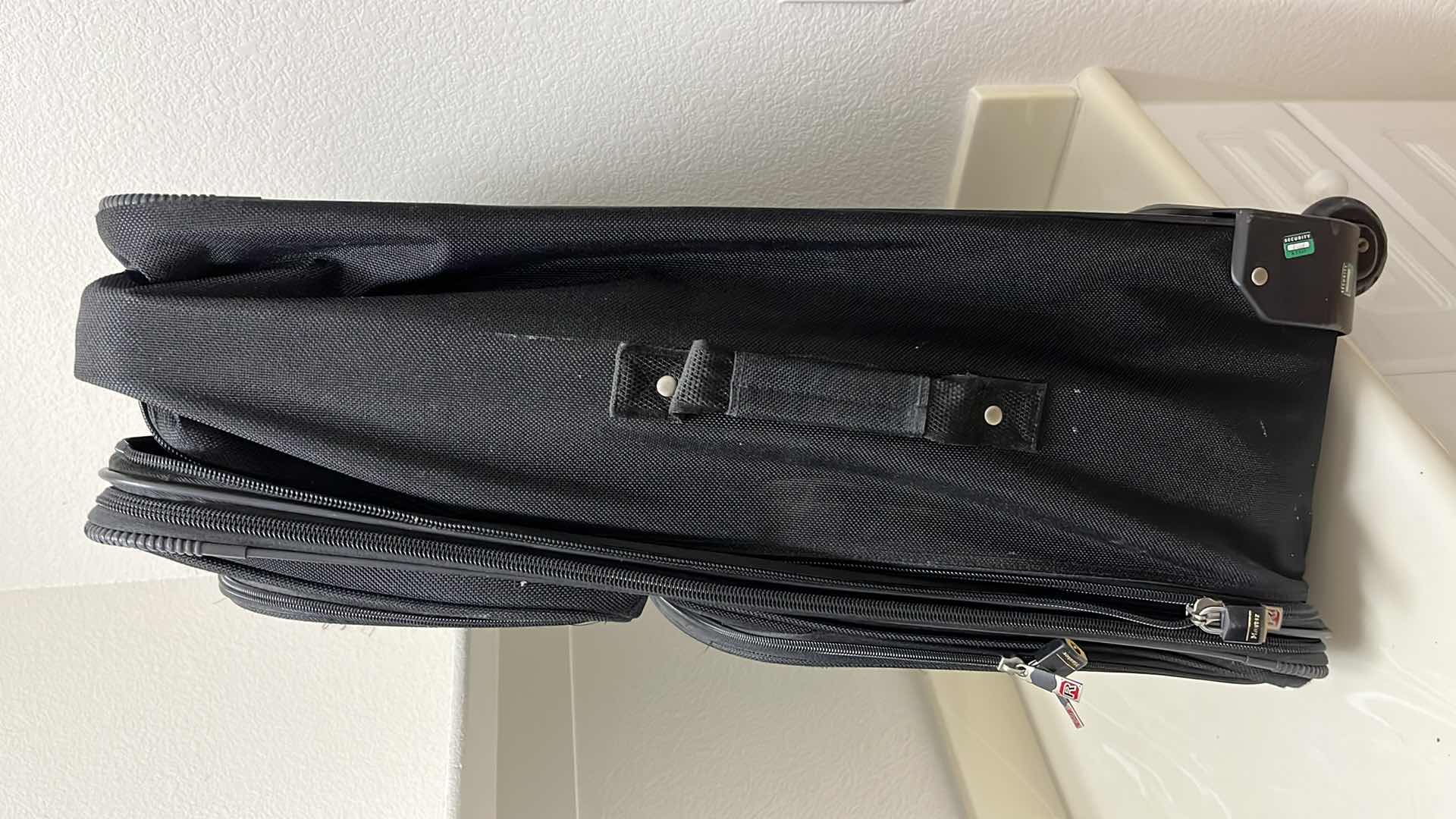 Photo 1 of BLACK ROLLING CHECK LUGGAGE BAG