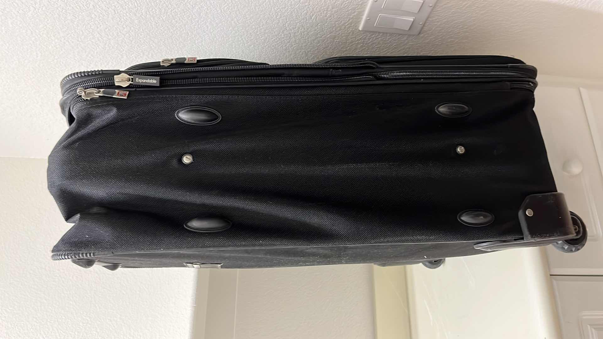 Photo 1 of BLACK ROLLING CHECK LUGGAGE BAG