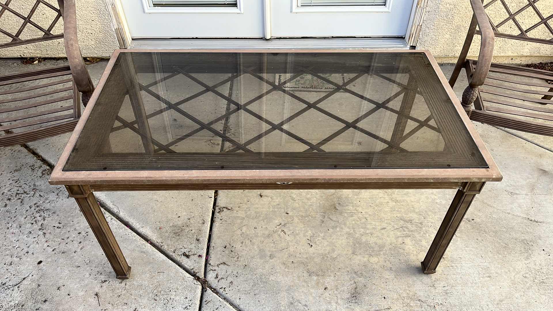 Photo 1 of HAMPTON BAY PATIO GLASS TOP METAL FRAME TABLE 50” X 28” H23.75” W 2 OVERSIZED METAL FRAME PATIO CHAIRS 28” X 36” H34”