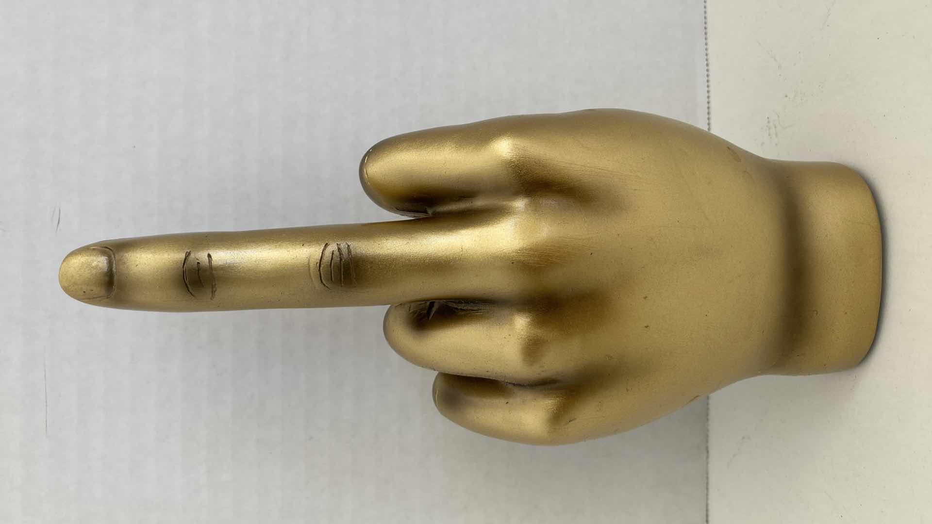 Photo 1 of GOLD FINISH MIDDLE FINGER HAND GESTURE RESIN STATUE H8.75”