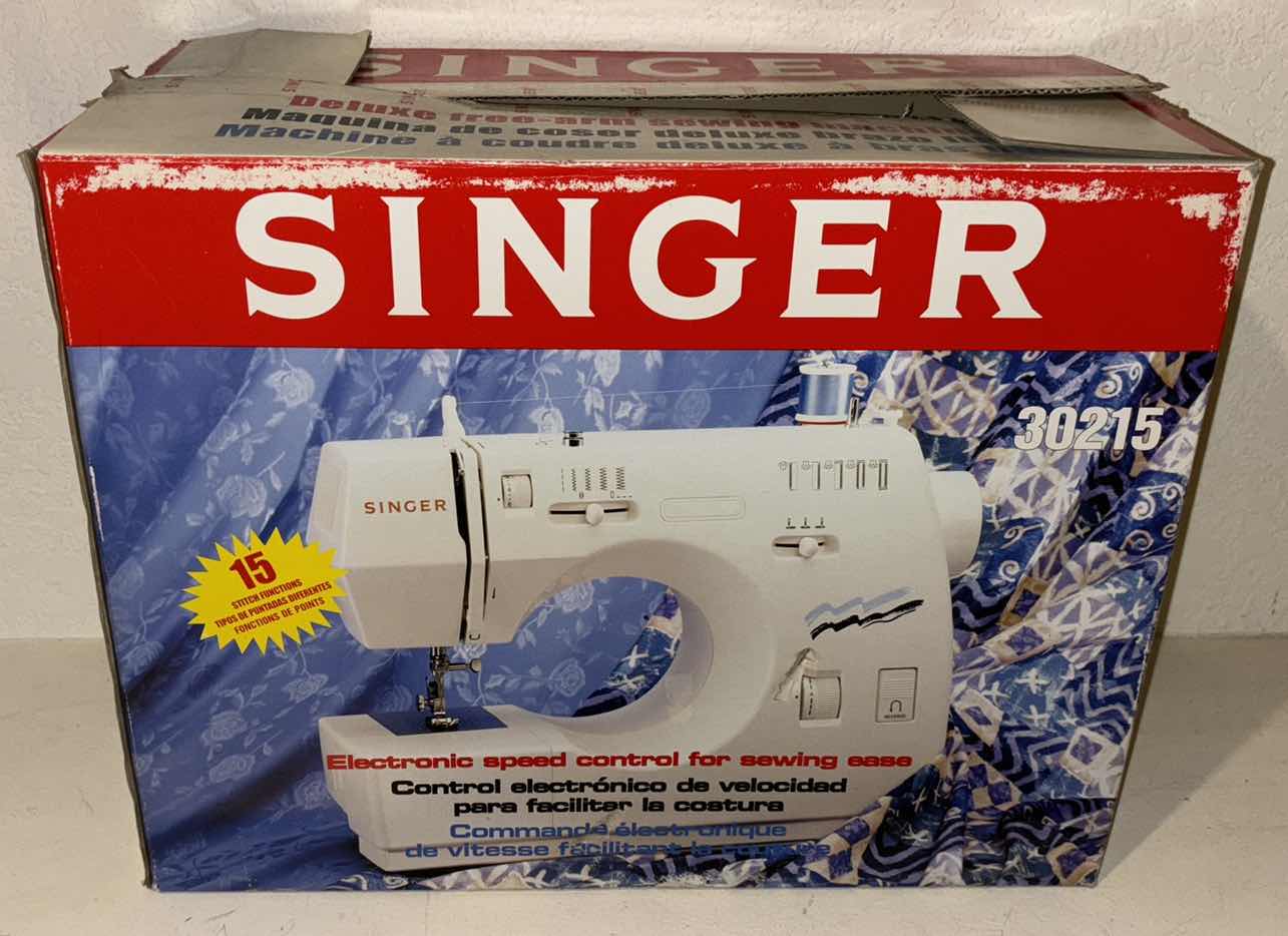 Photo 1 of SINGER DELUXE FREE-ARM 15 STITCH SEWING MACHINE (30215)