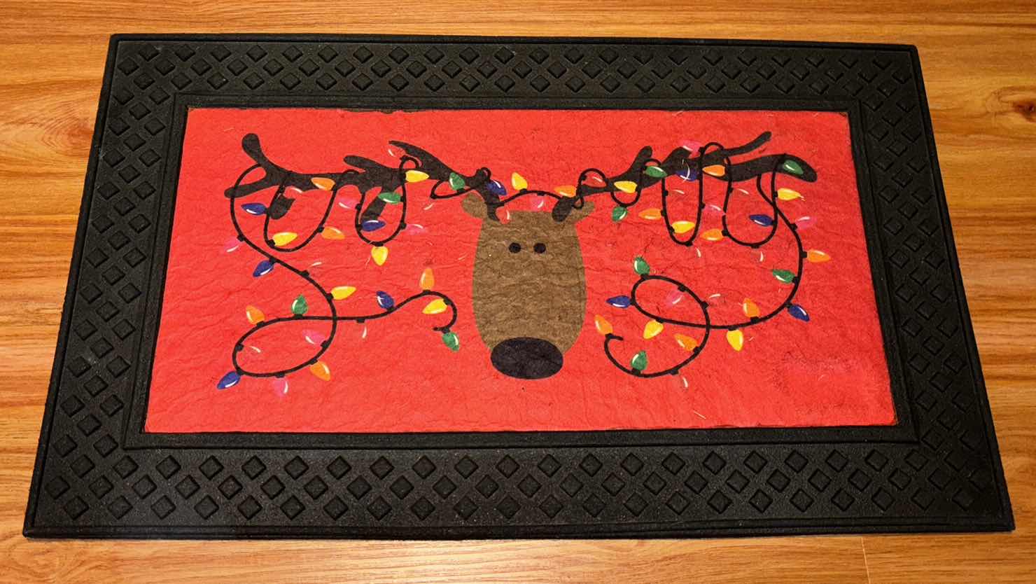 Photo 1 of PIER 1 IMPORTS LED LIGHT-UP REINDEER MUSICAL DOORMAT 18.25” X 30”