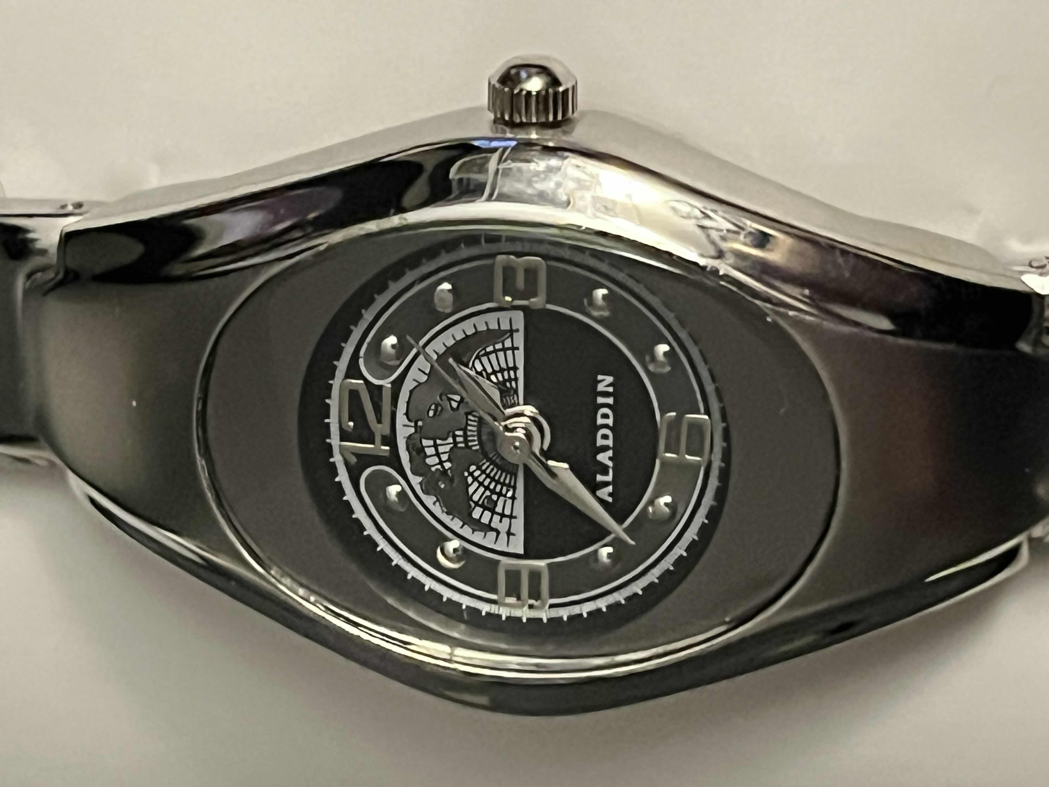 Photo 1 of ALADDIN CASINO LIMITED COLLECTORS EDITION TEAM ALADDIN HIS & HERS SILVERTONE WORLD MAP FACE STAINLESS STEEL LINK WATCHES W CASES