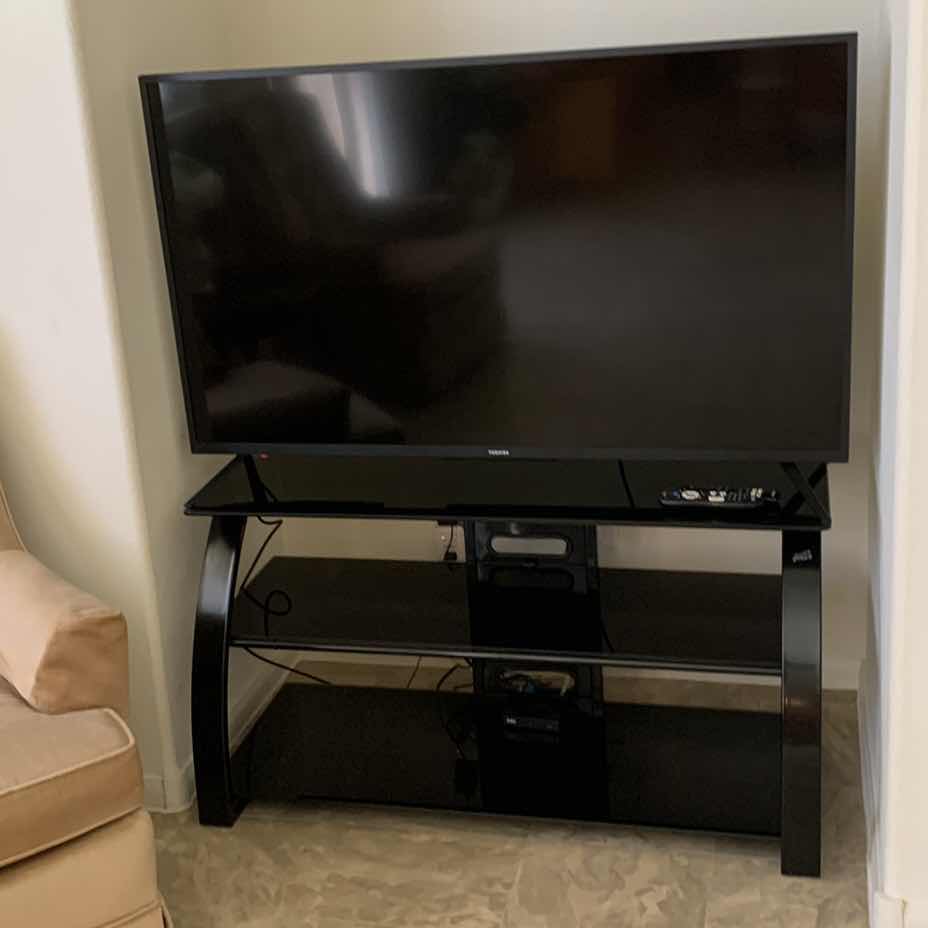 Photo 1 of TOSHIBA TELEVISION WITH STAND AND REMOTE